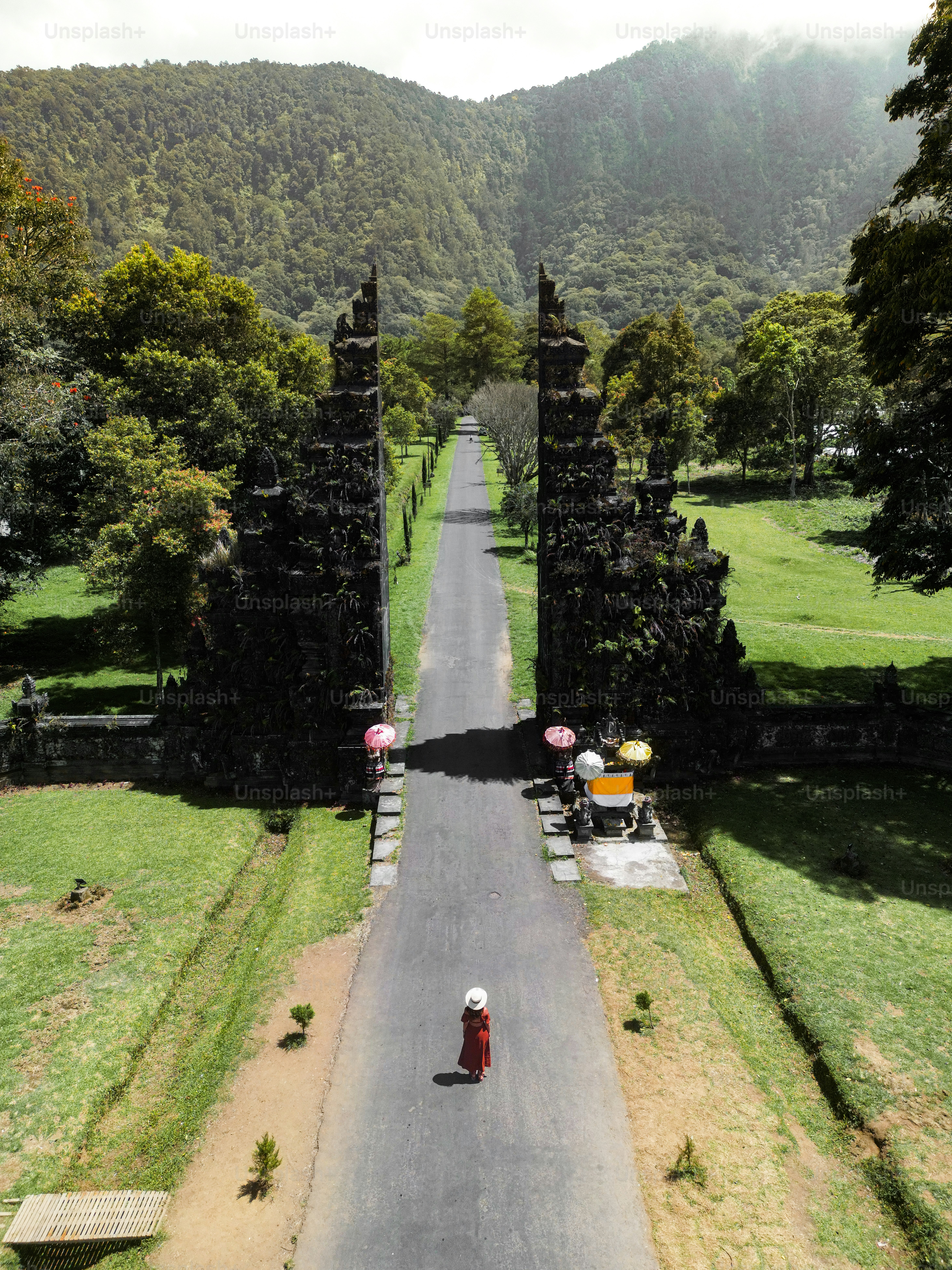 A person riding a motorcycle down a road