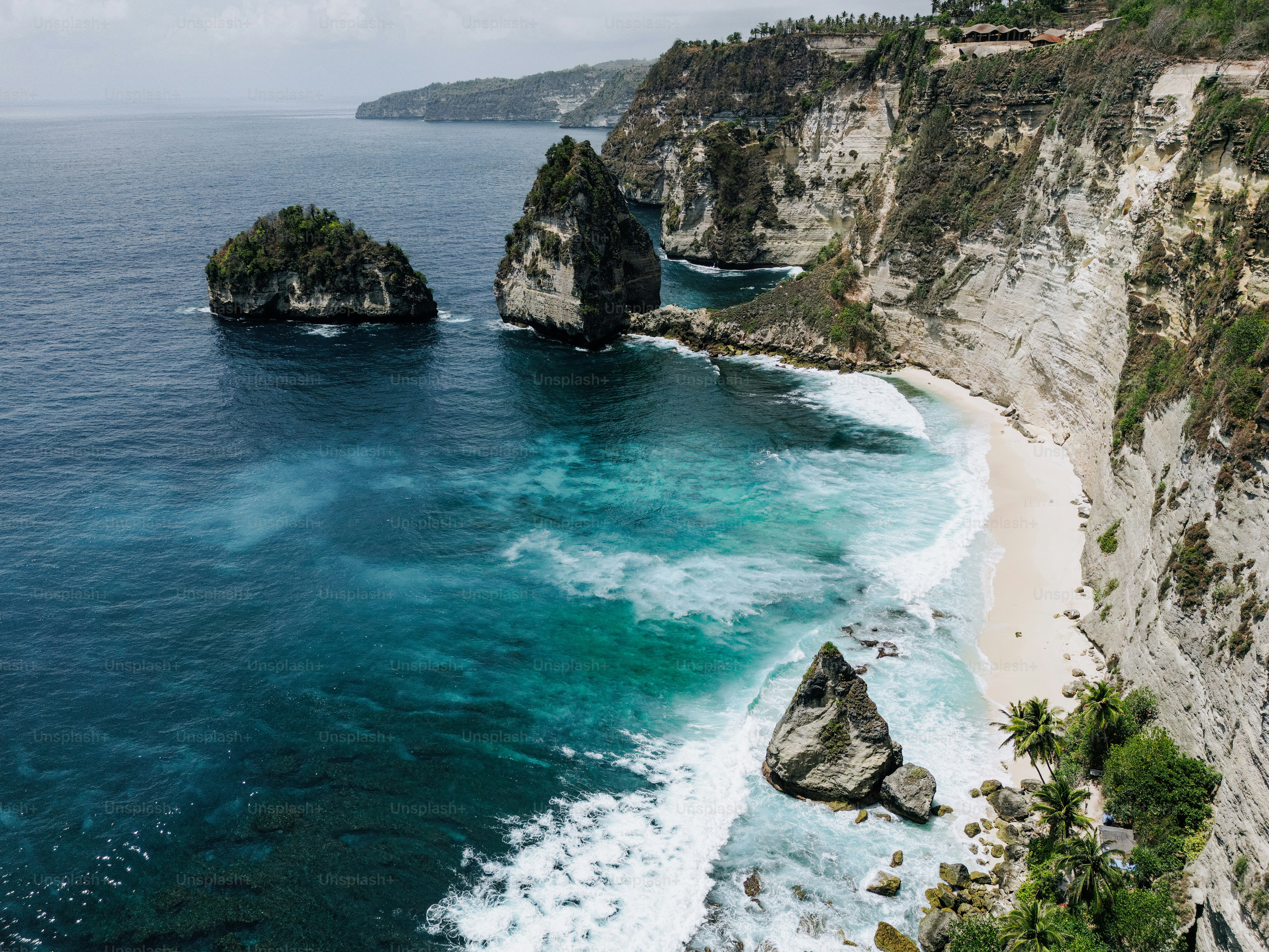 An aerial view of a beach and a cliff