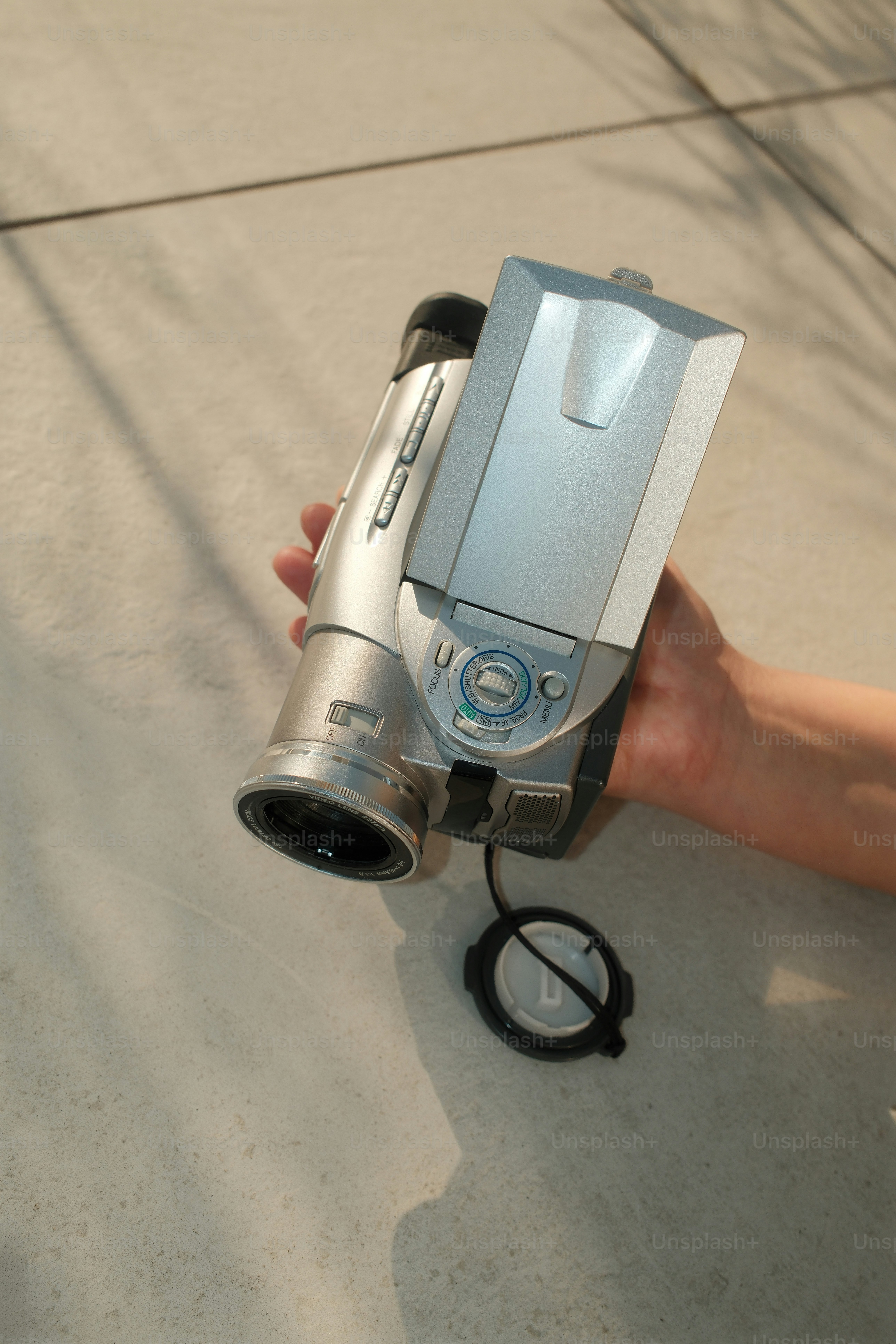 A person holding a camera in their hand