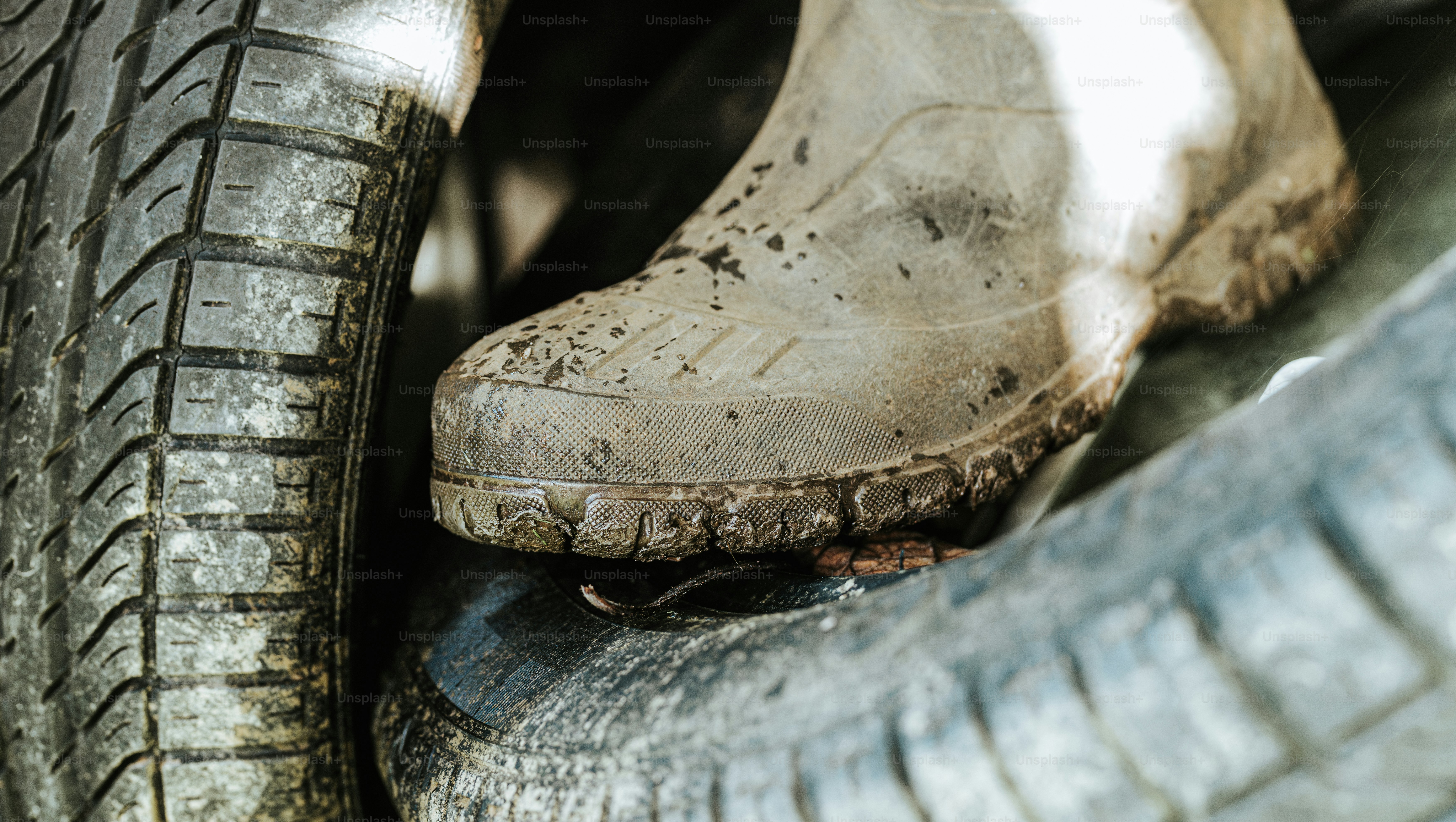 A close up of a pair of shoes on a tire
