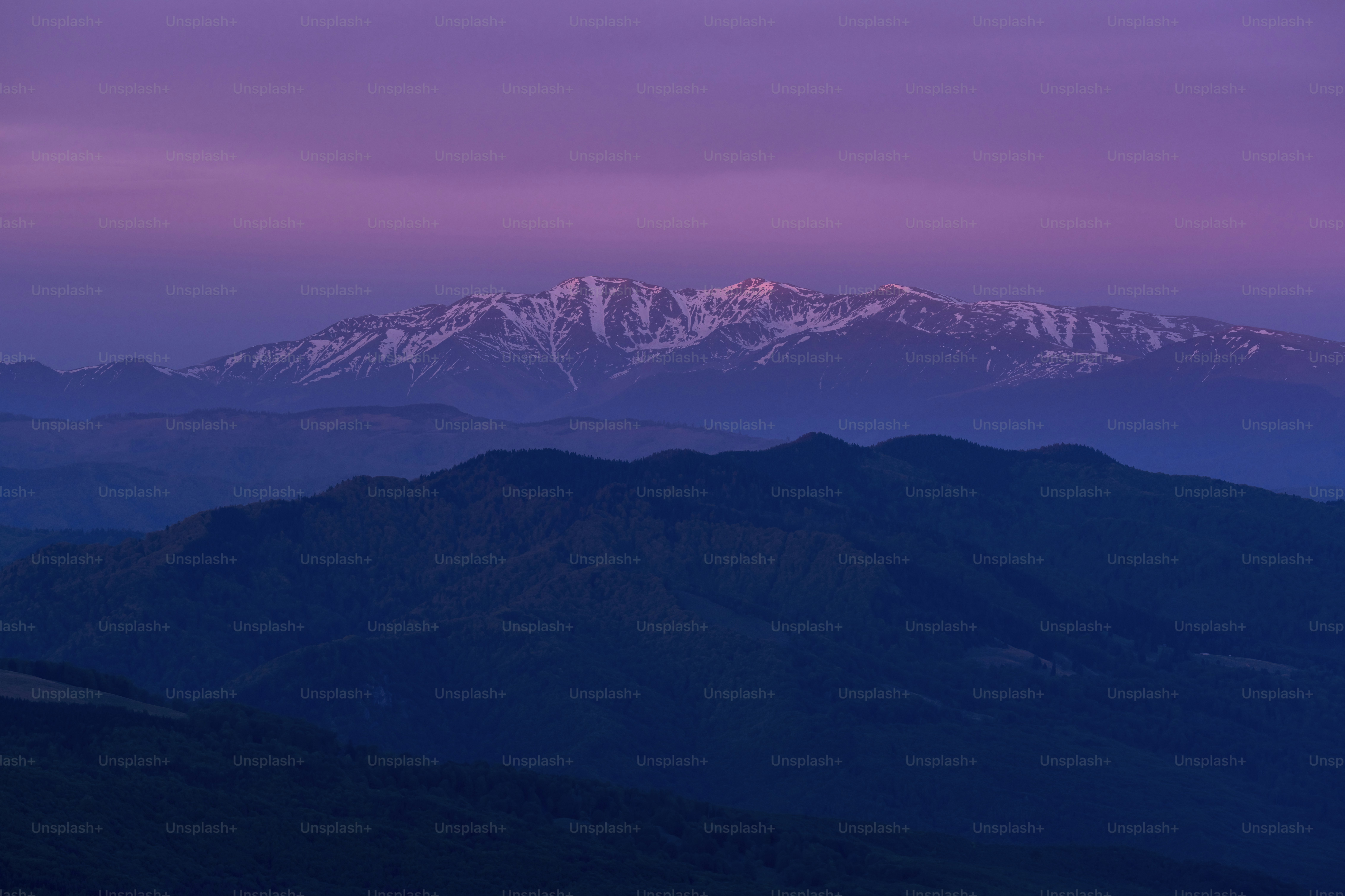 A view of a mountain range at dusk
