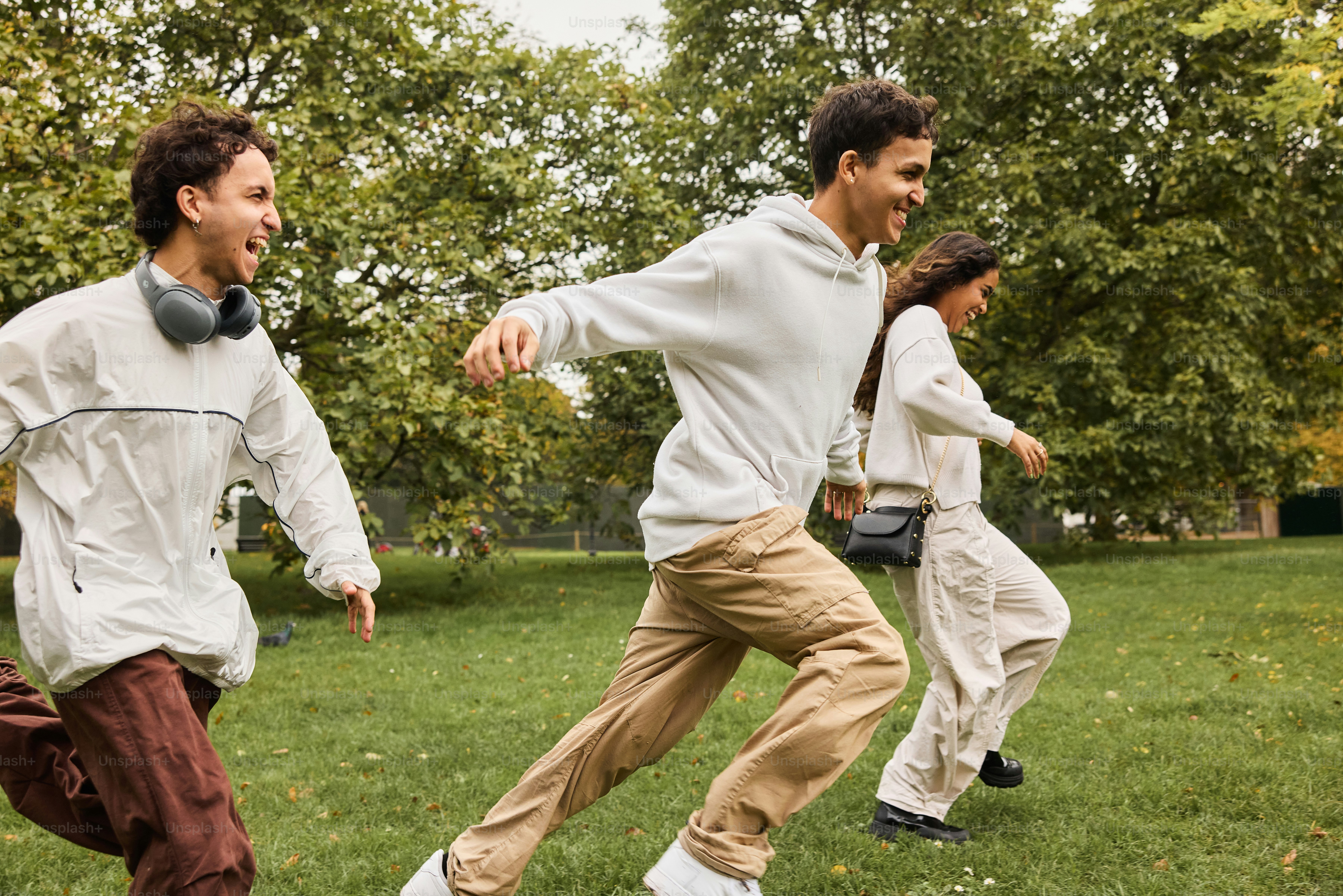 A group of young men playing a game of frisbee