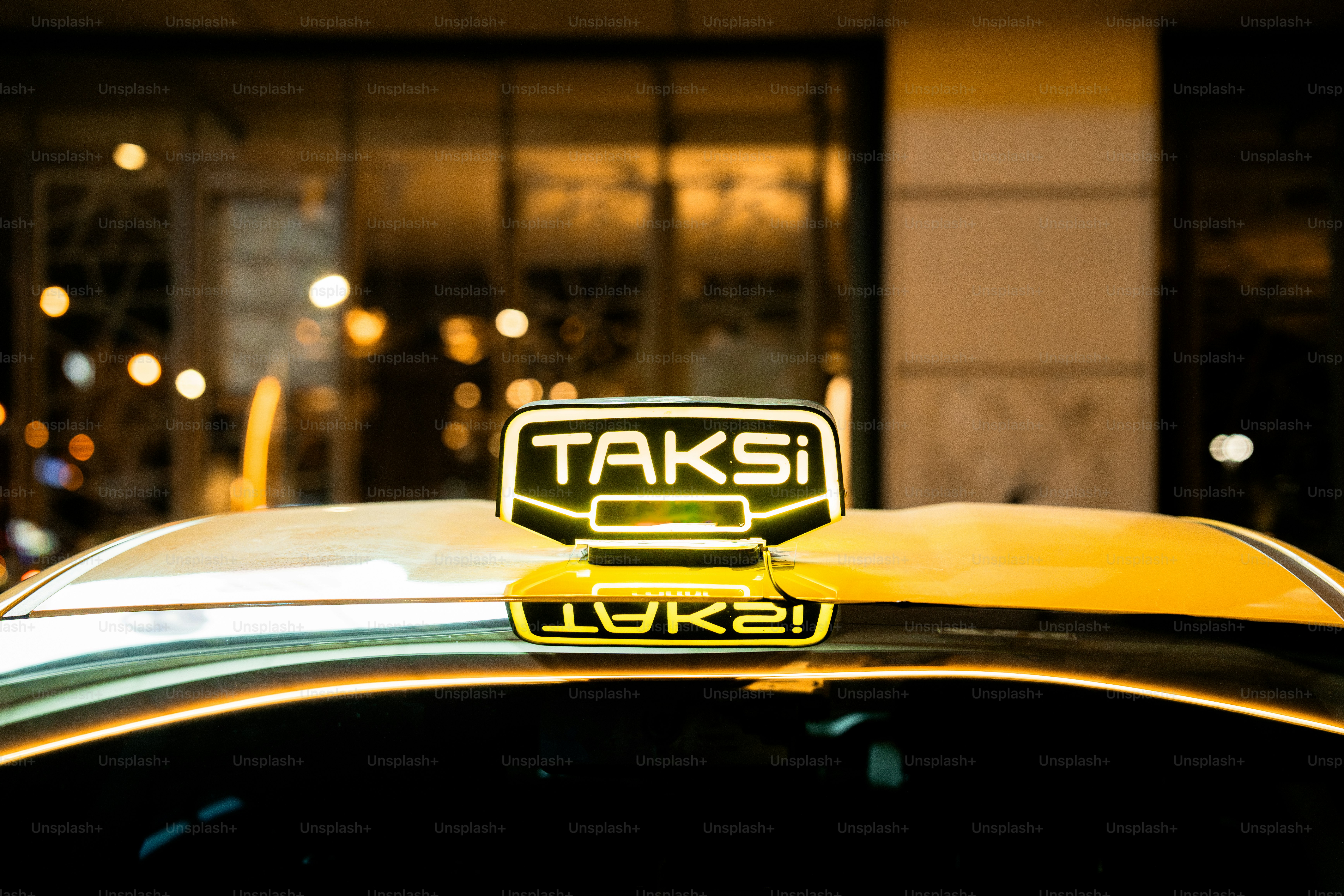 A taxi cab parked in front of a building