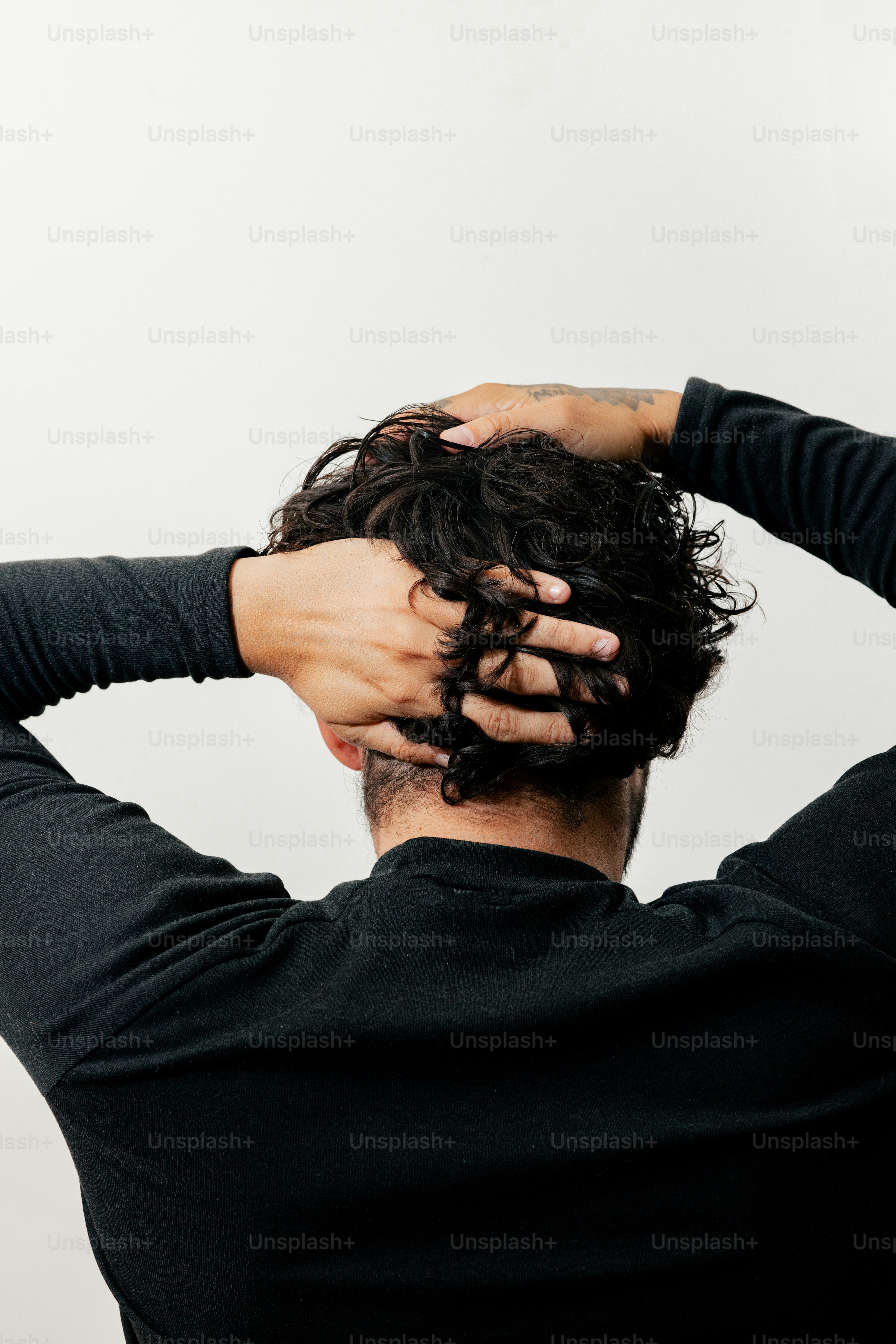 A man with his hands on his head