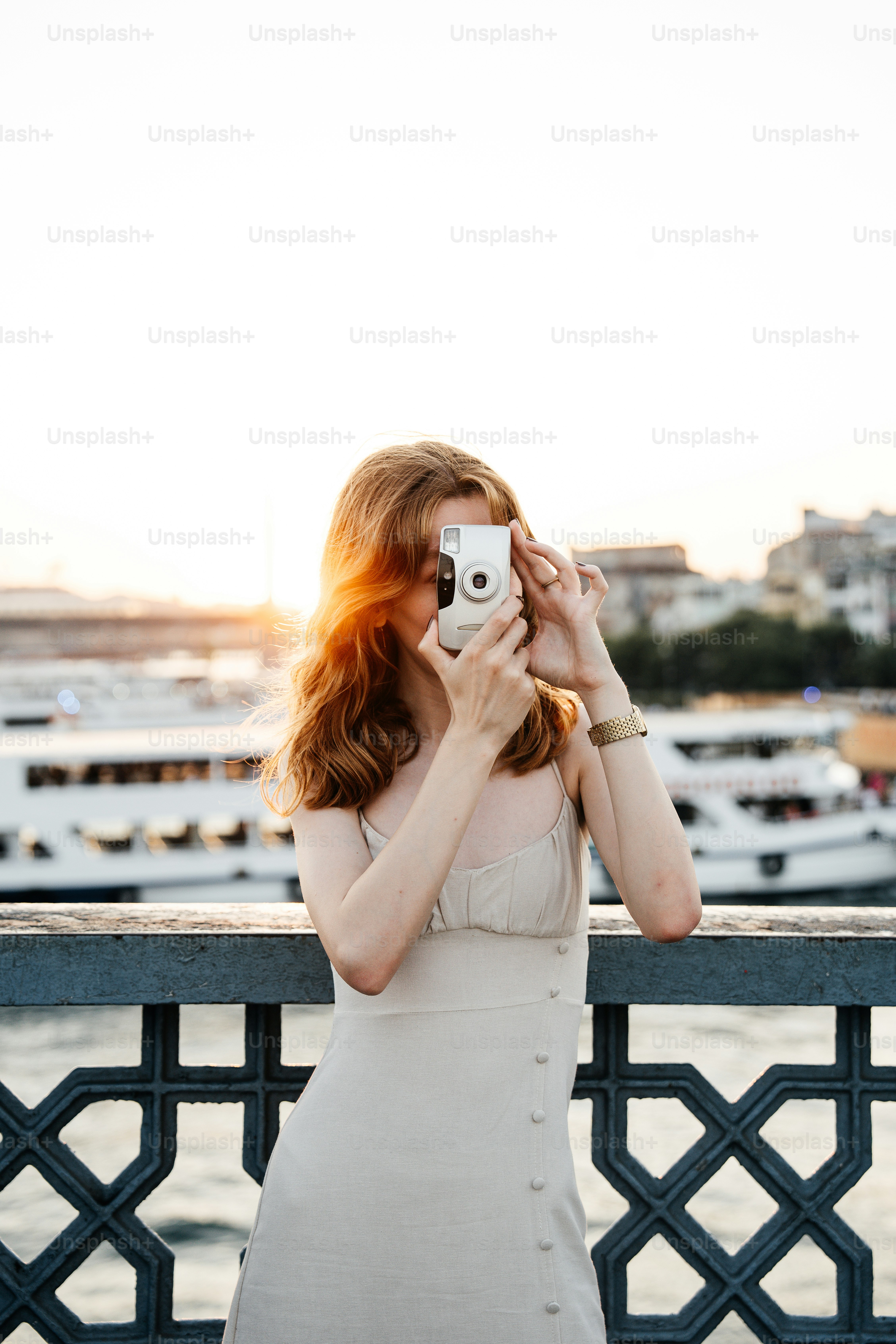 A woman taking a picture of herself with a camera