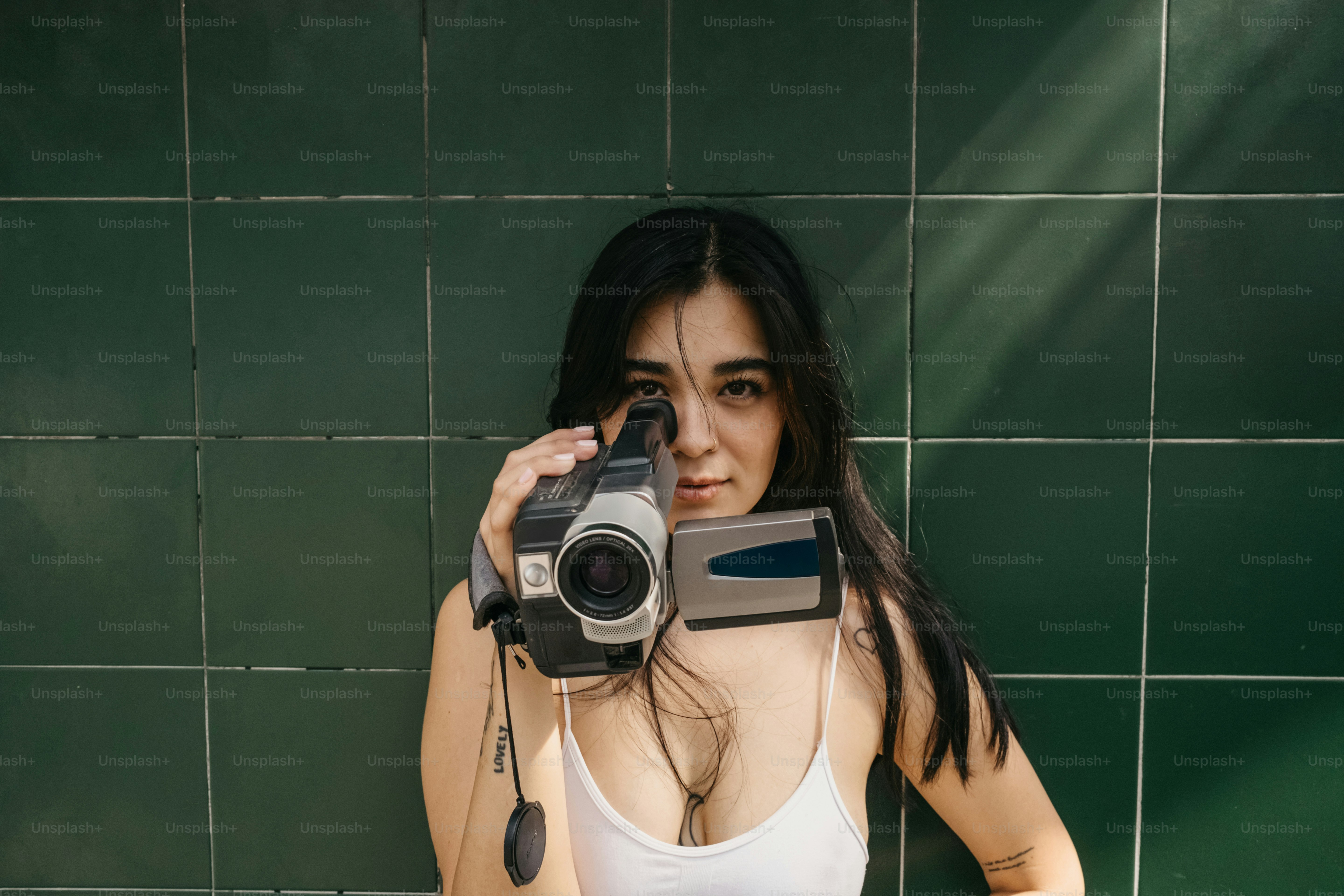 A woman taking a picture of herself with a camera
