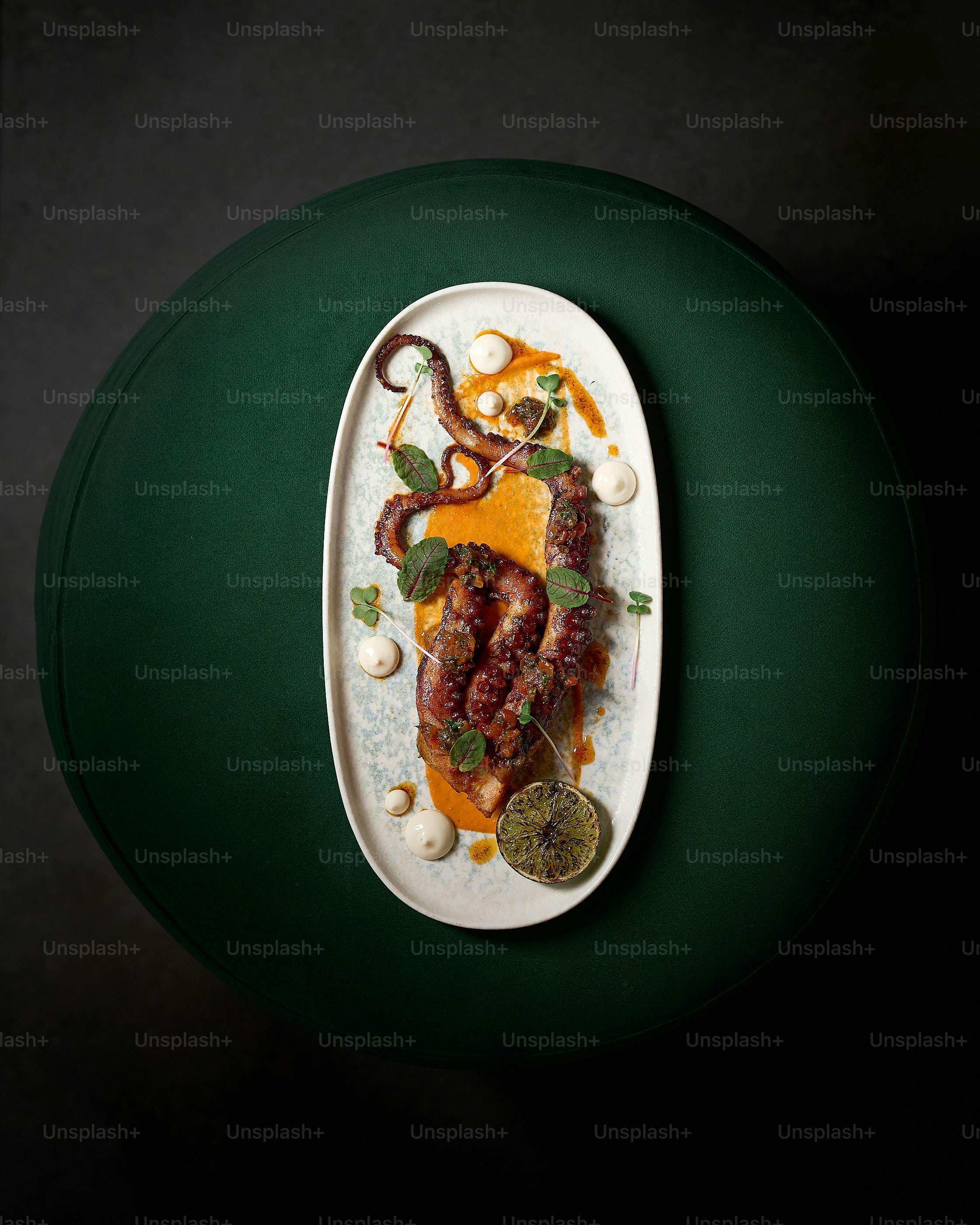 A white plate topped with meat and vegetables