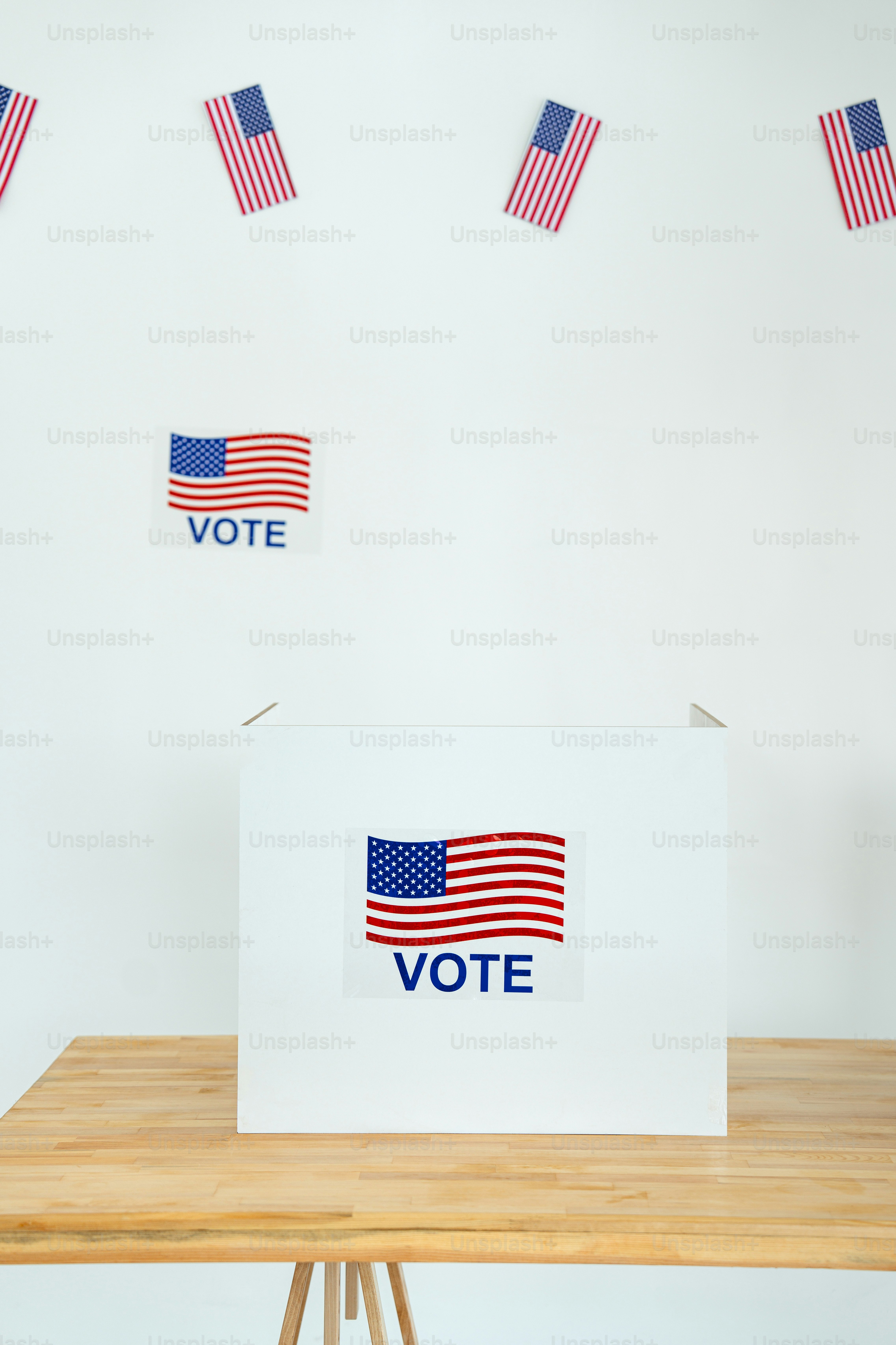 A voting box sitting on top of a wooden table