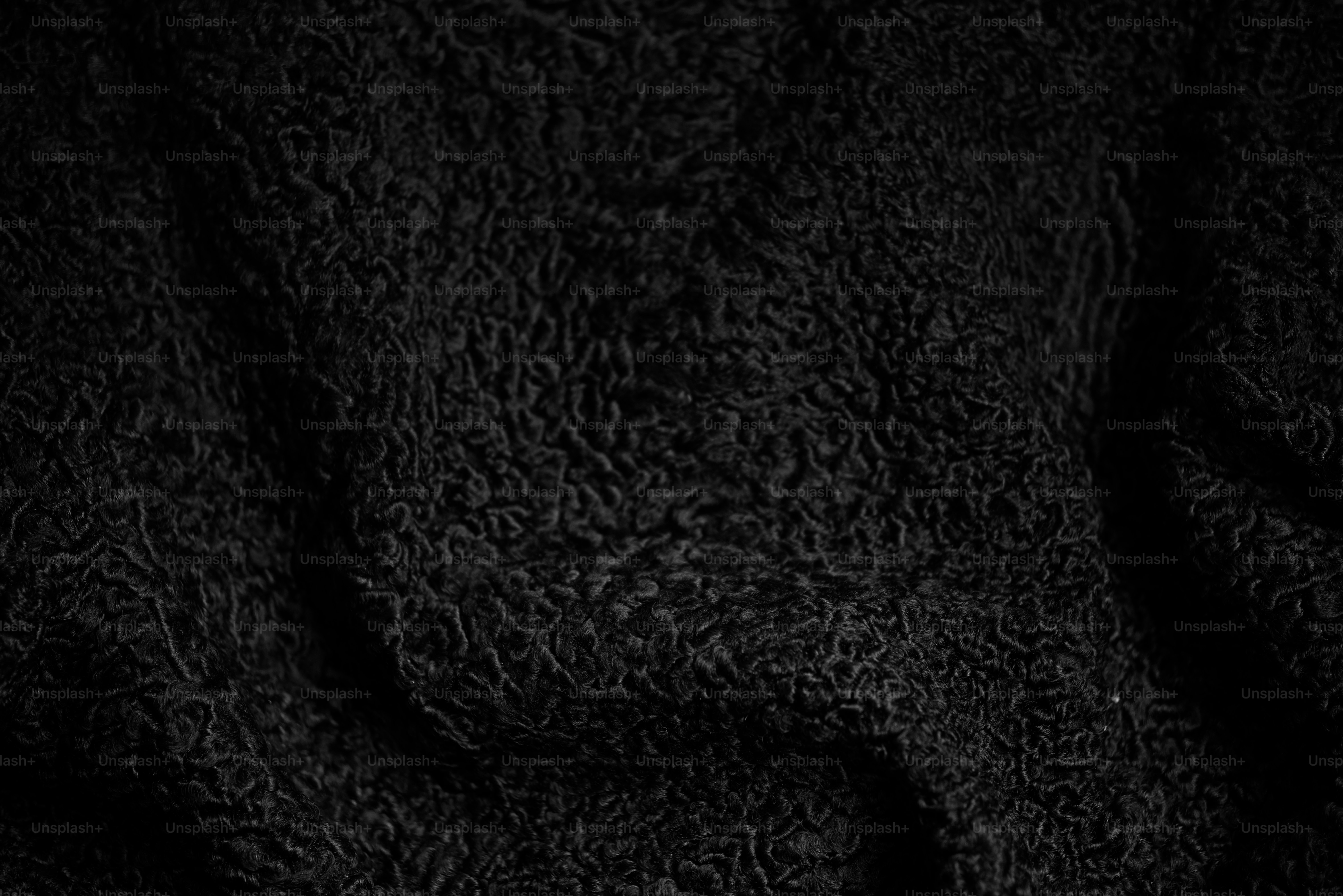 A close up of a cell phone with a black background