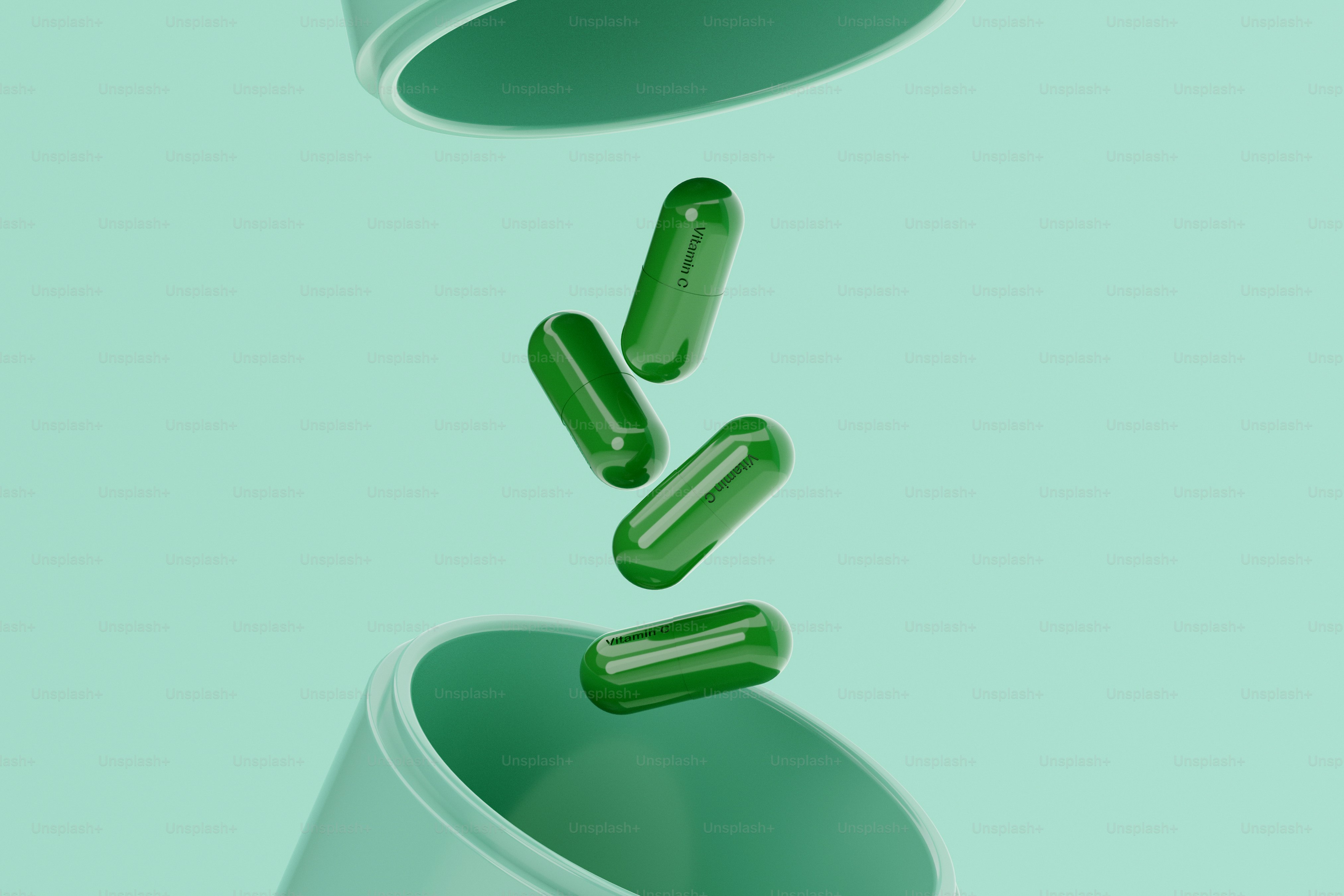 Green pills falling out of a white cup