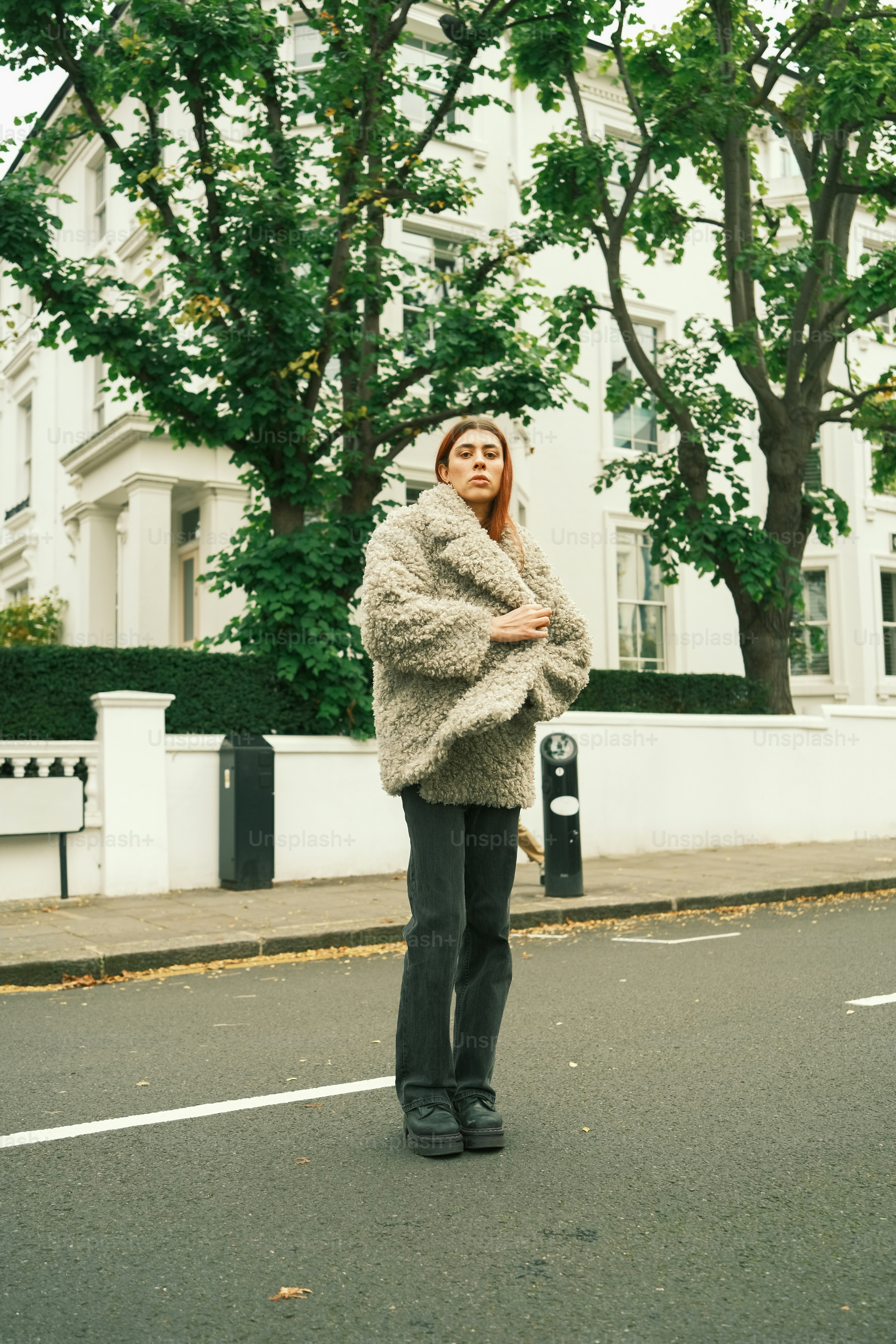 A woman standing in the middle of a street photo – Beyond binary Image ...