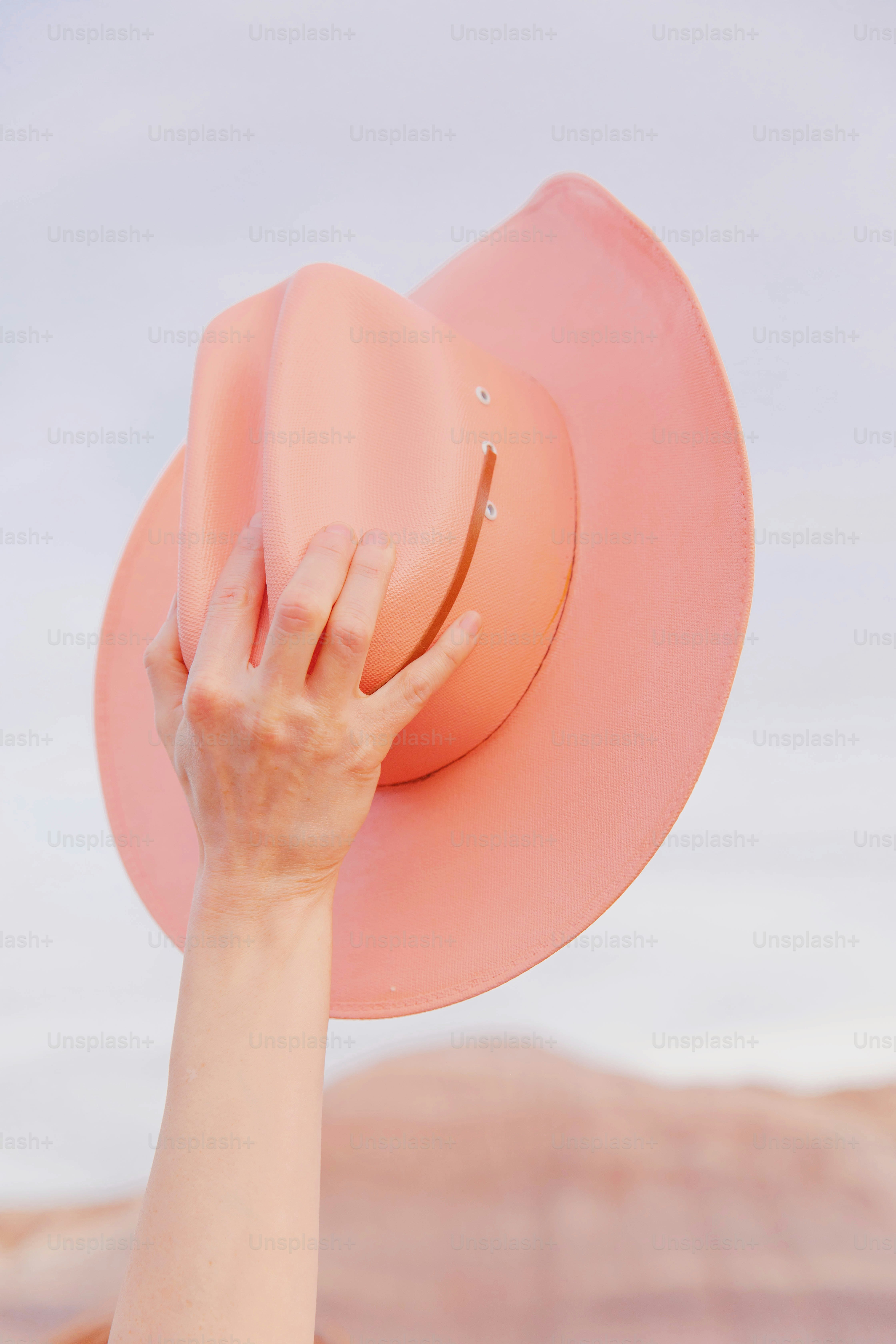 A woman with a pink hat on her head