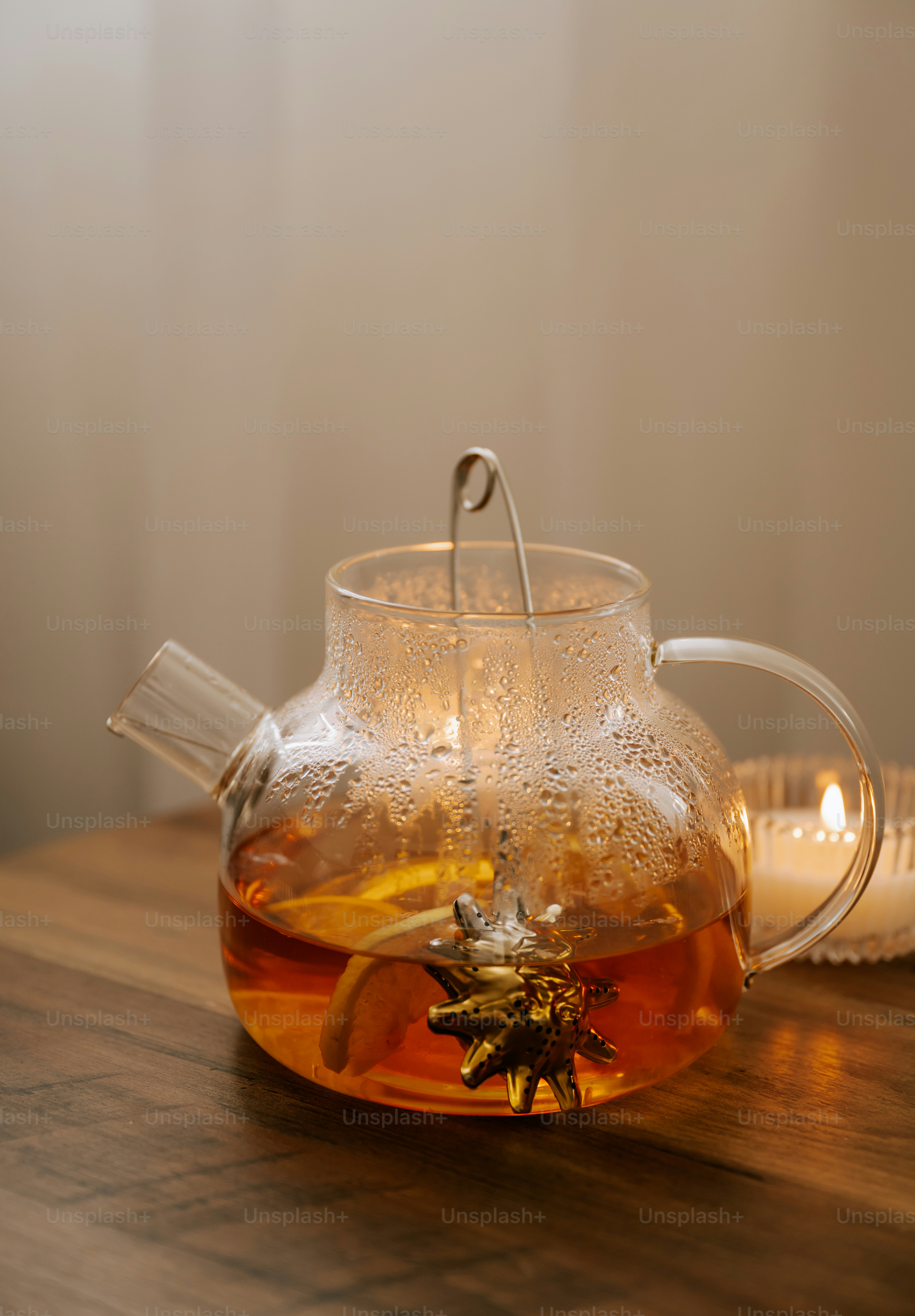 A tea pot with a tea in it on a table