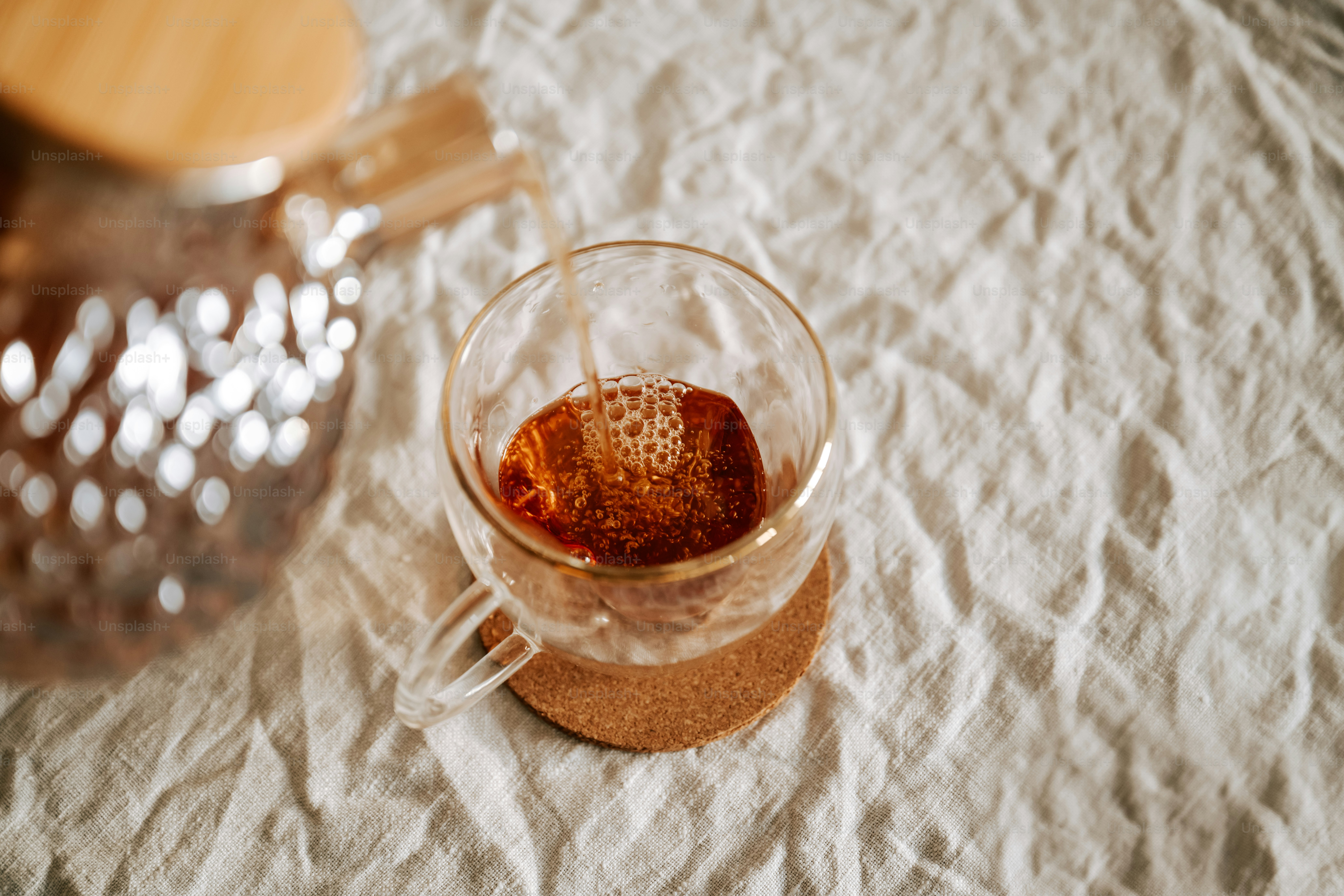 A wooden table topped with a tea pot filled with tea photo – Tea Image ...