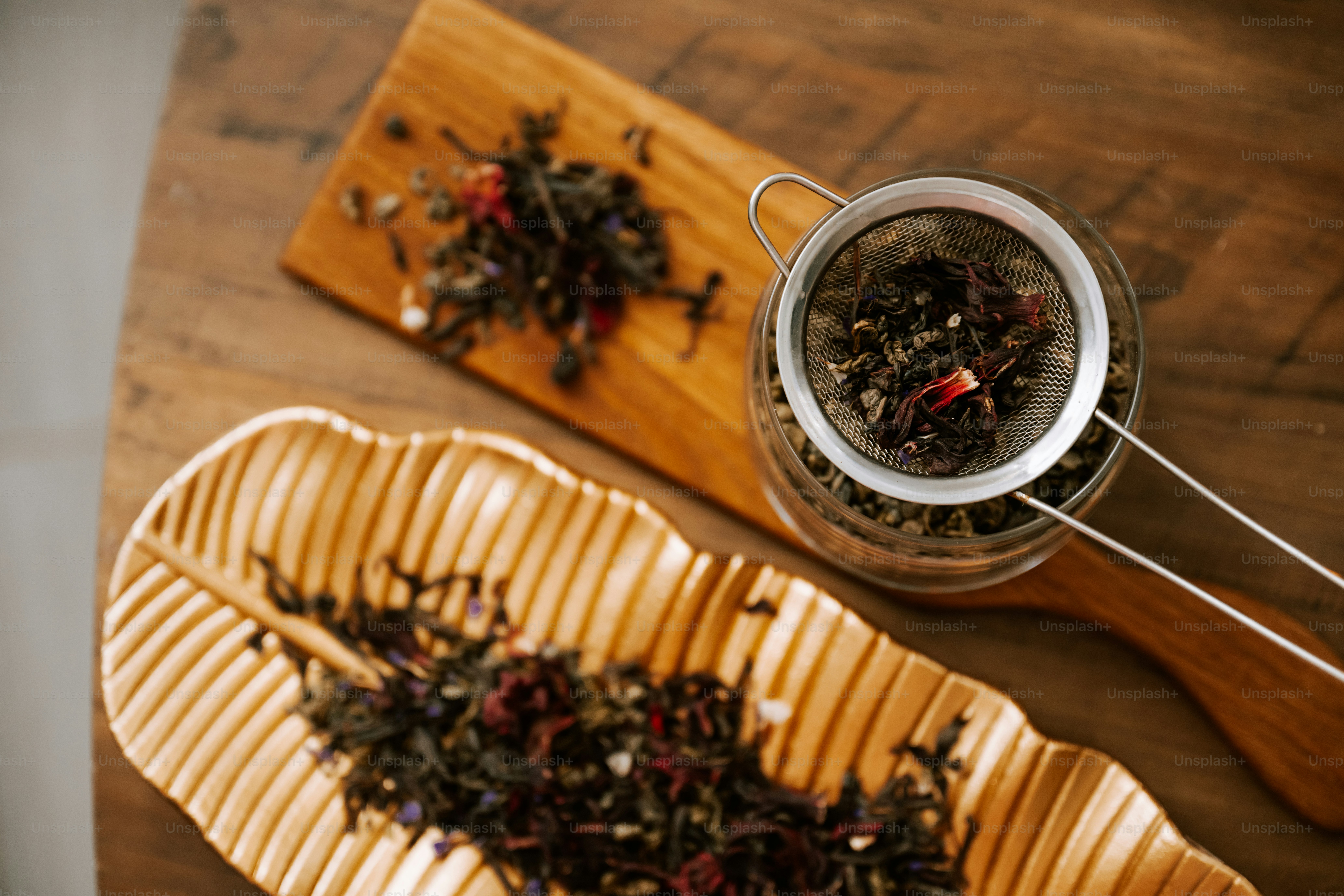 A cup of tea next to a wooden spoon