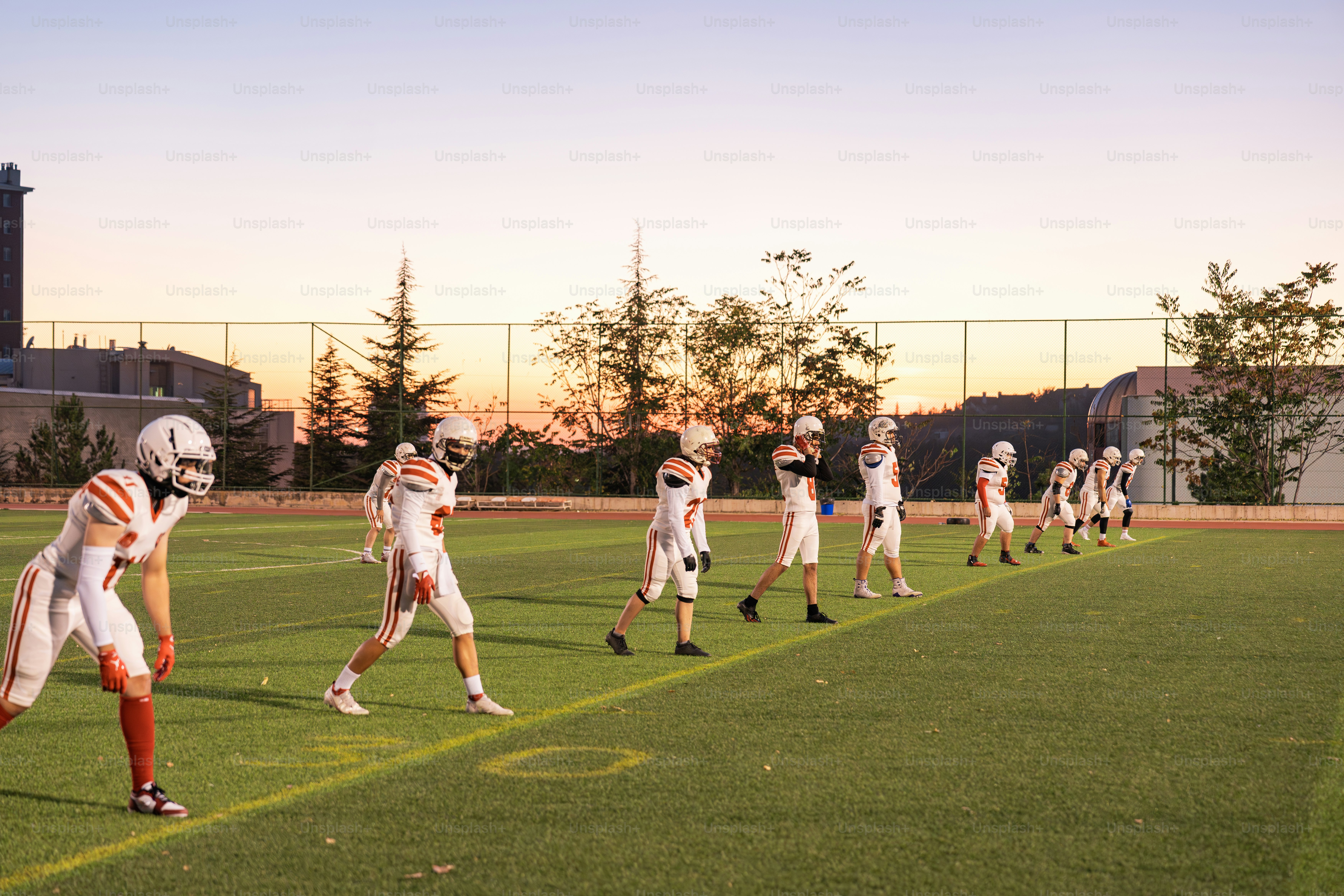 A group of people on a field playing football
