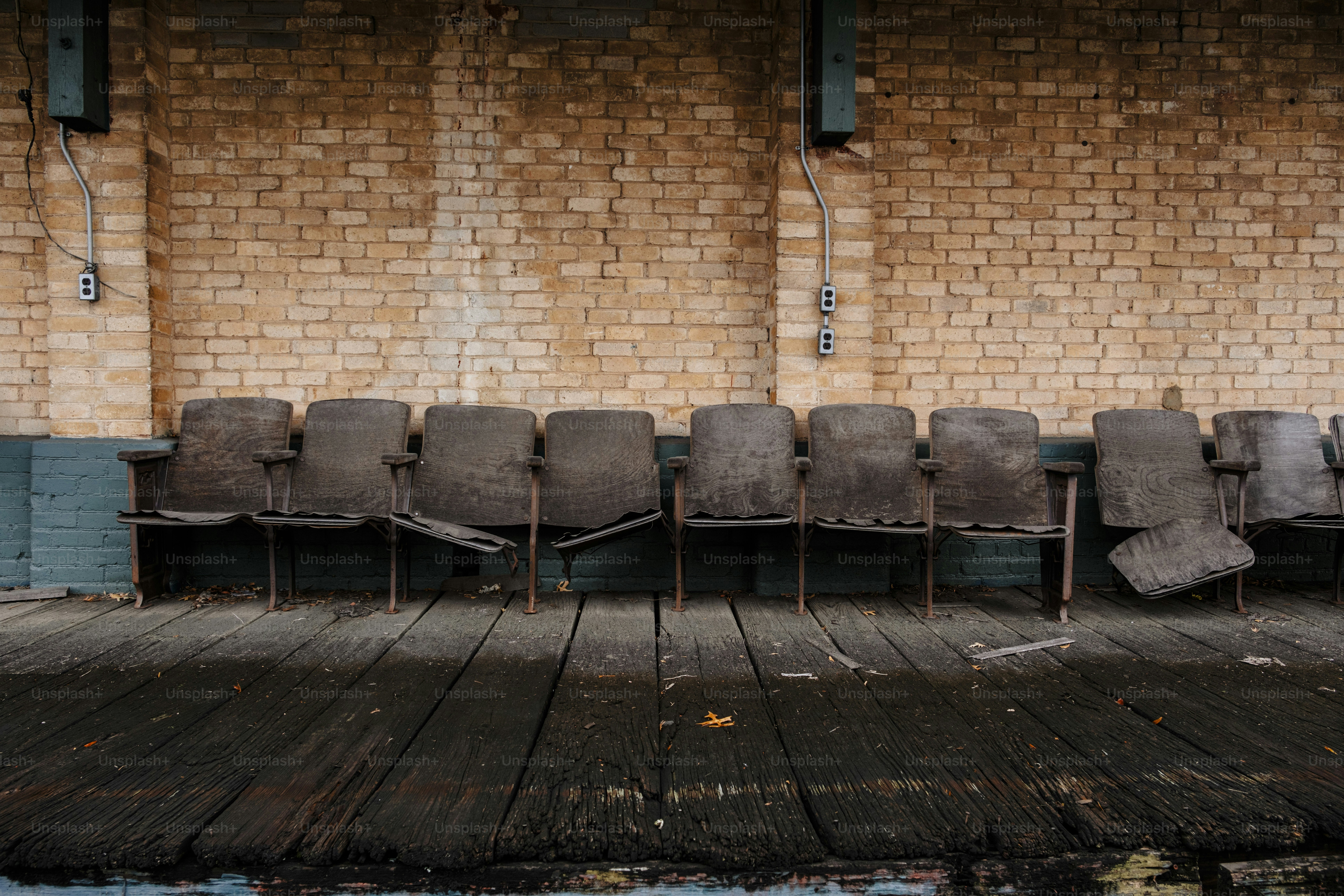 A row of chairs sitting on top of a wooden floor