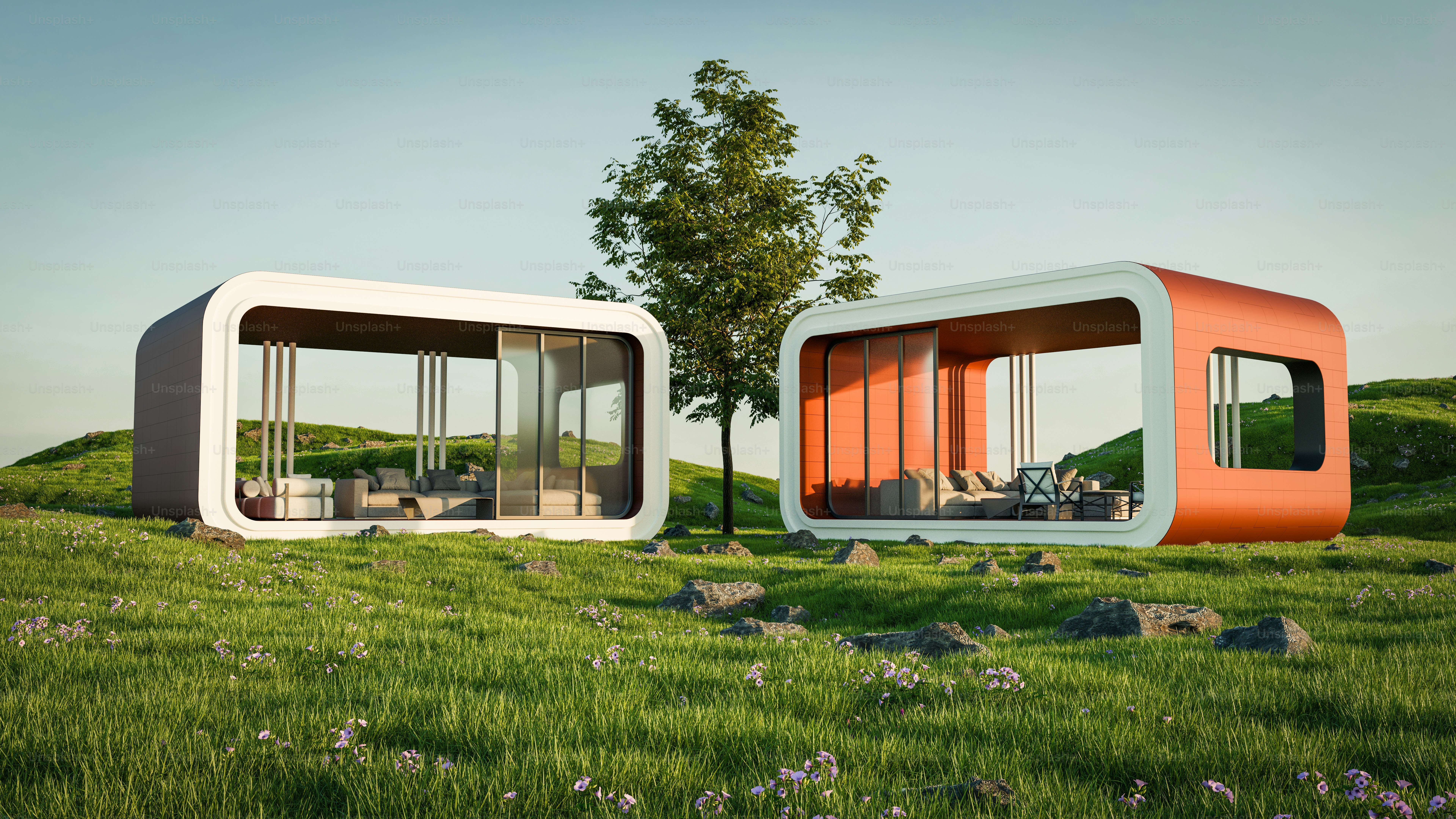 A couple of buildings sitting on top of a lush green field