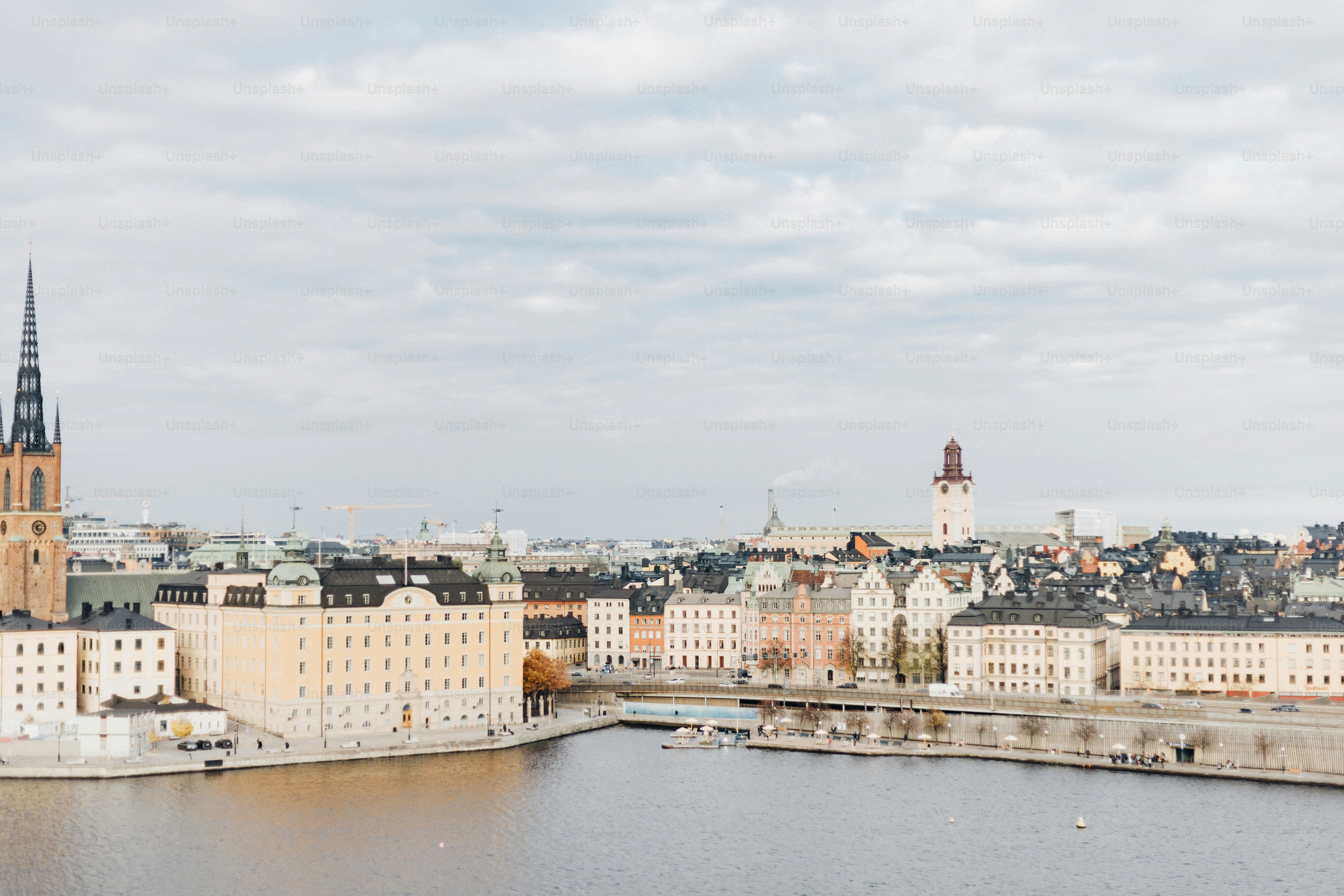 A large body of water with a city in the background