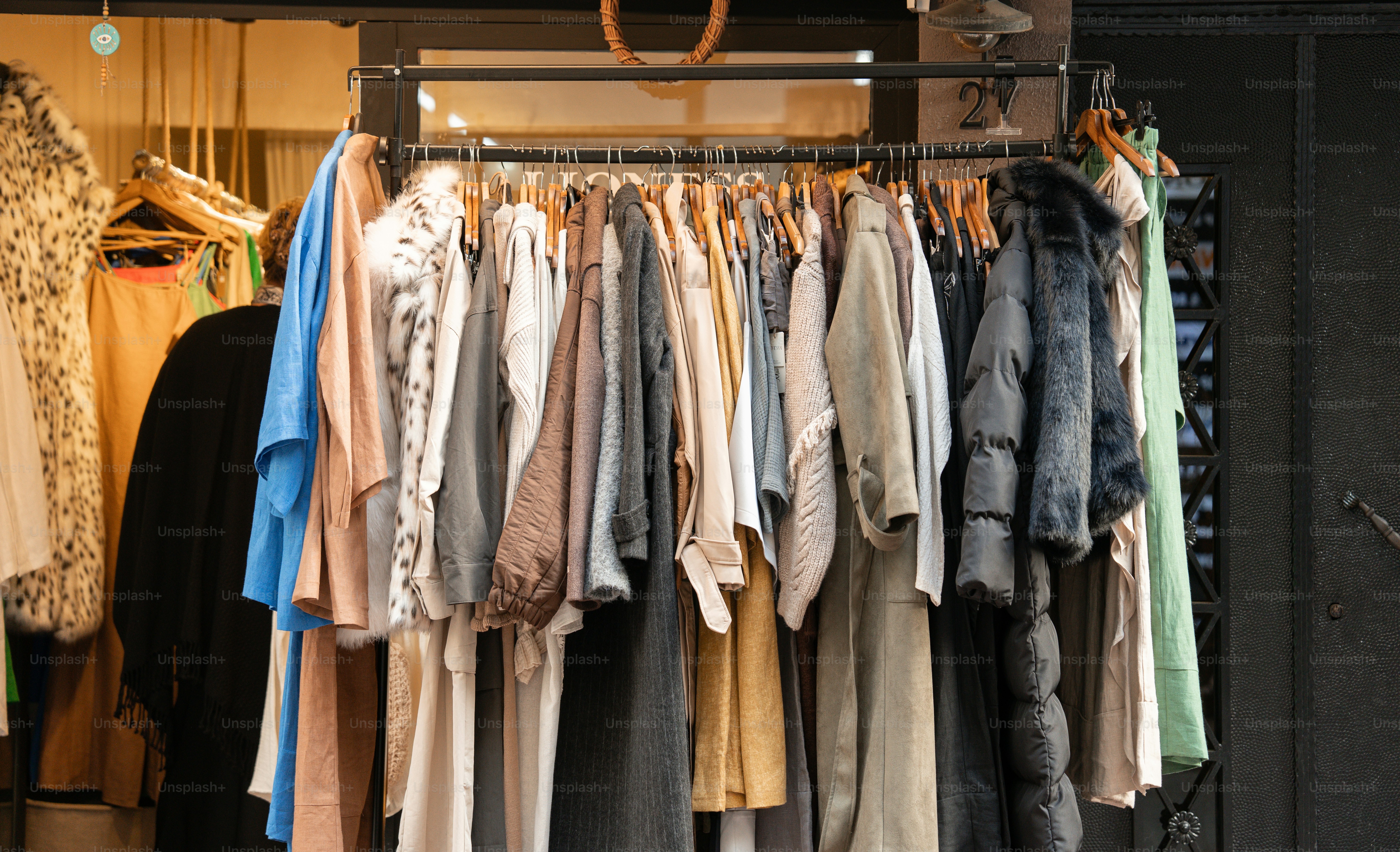 A rack of clothes hanging in a closet photo – Fashion Image on Unsplash