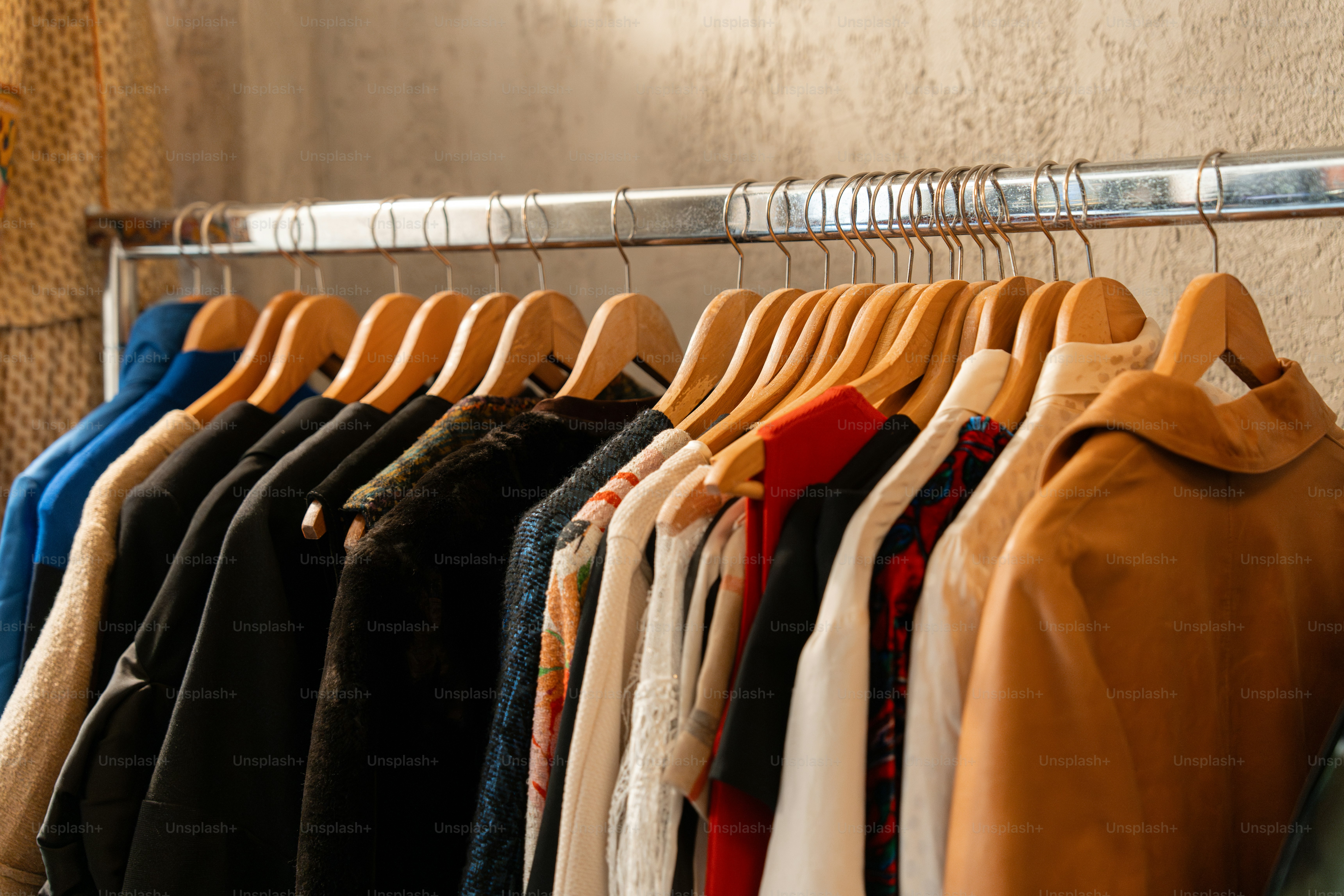 A rack of clothes hanging on a rail