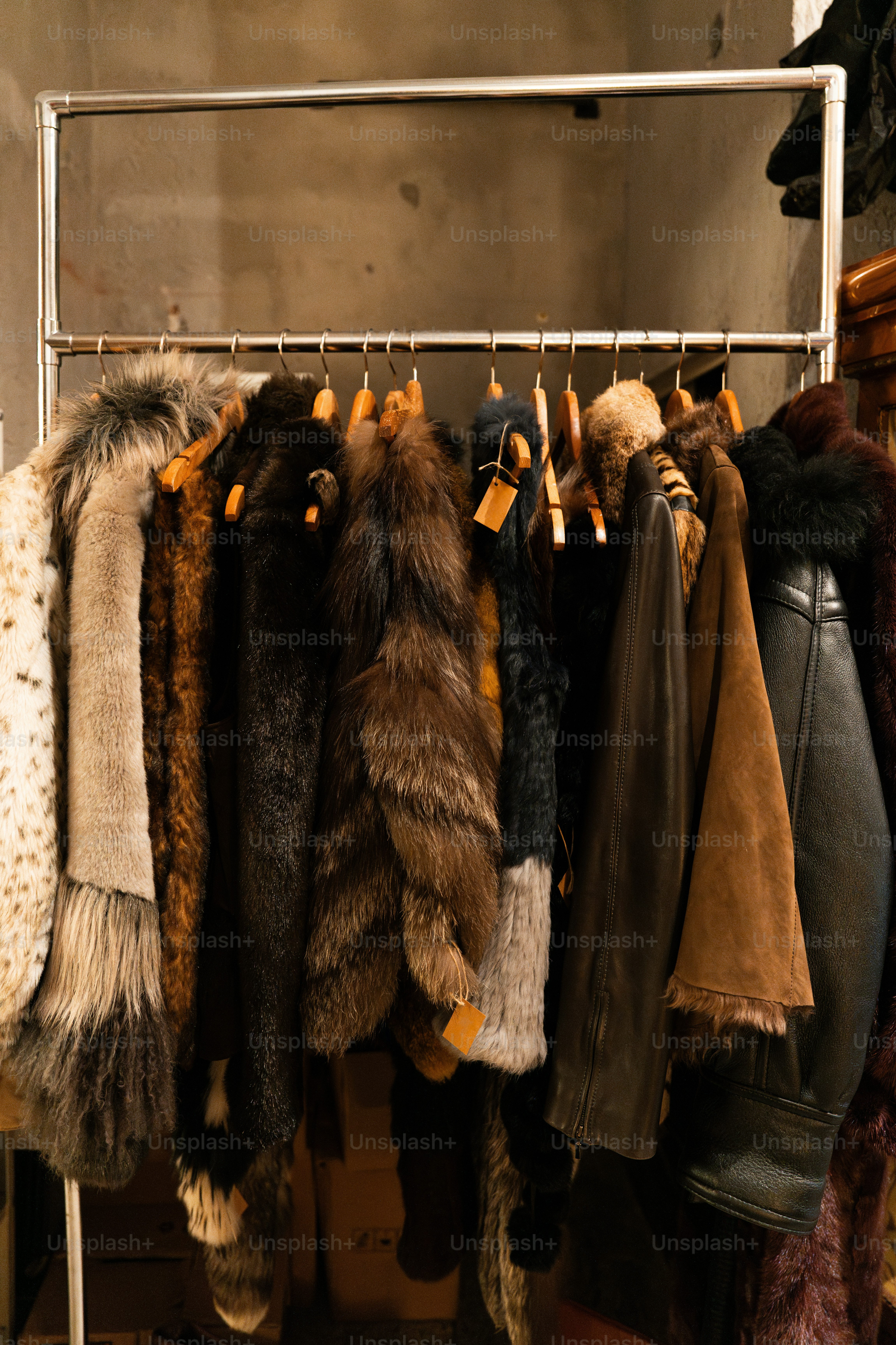 A rack of coats hanging on a rail
