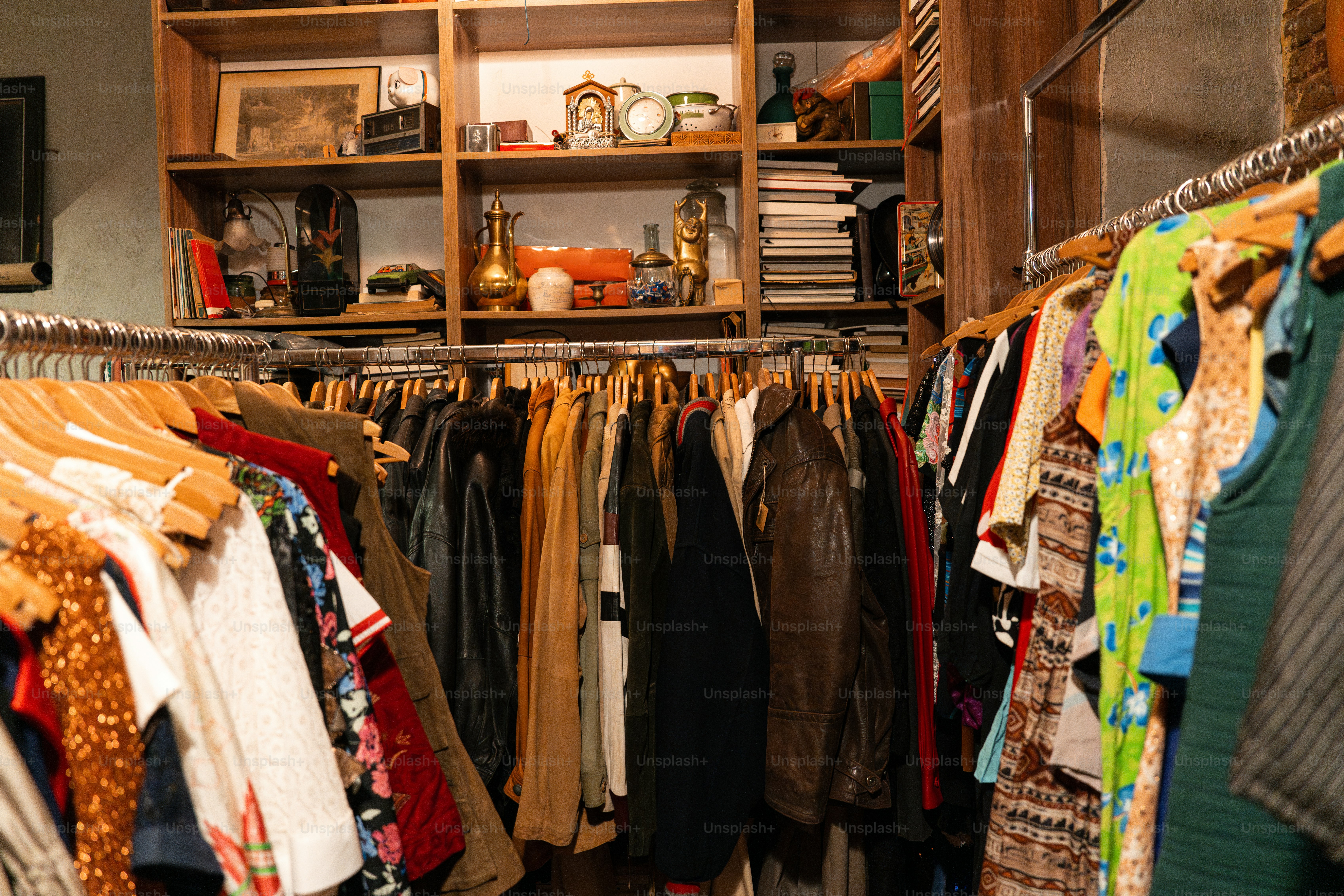 A closet filled with lots of clothes and shoes