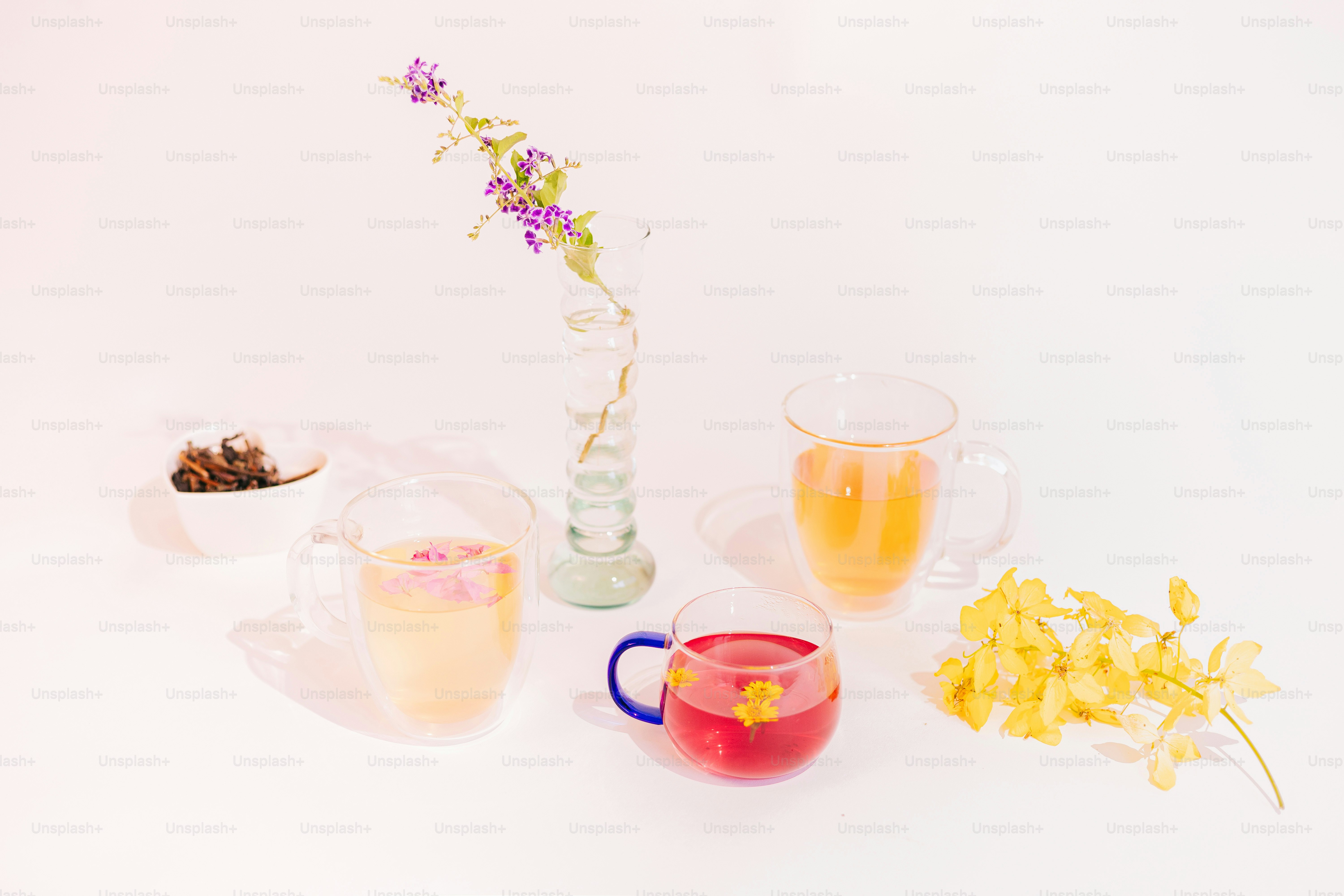 A white table topped with a vase filled with flowers