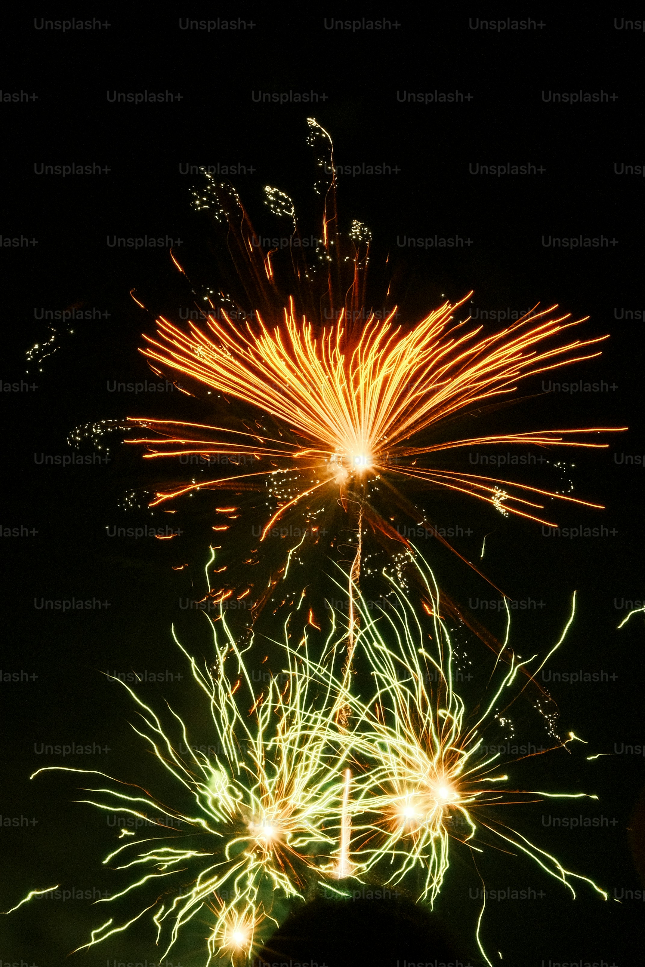 A group of people watching a fireworks display