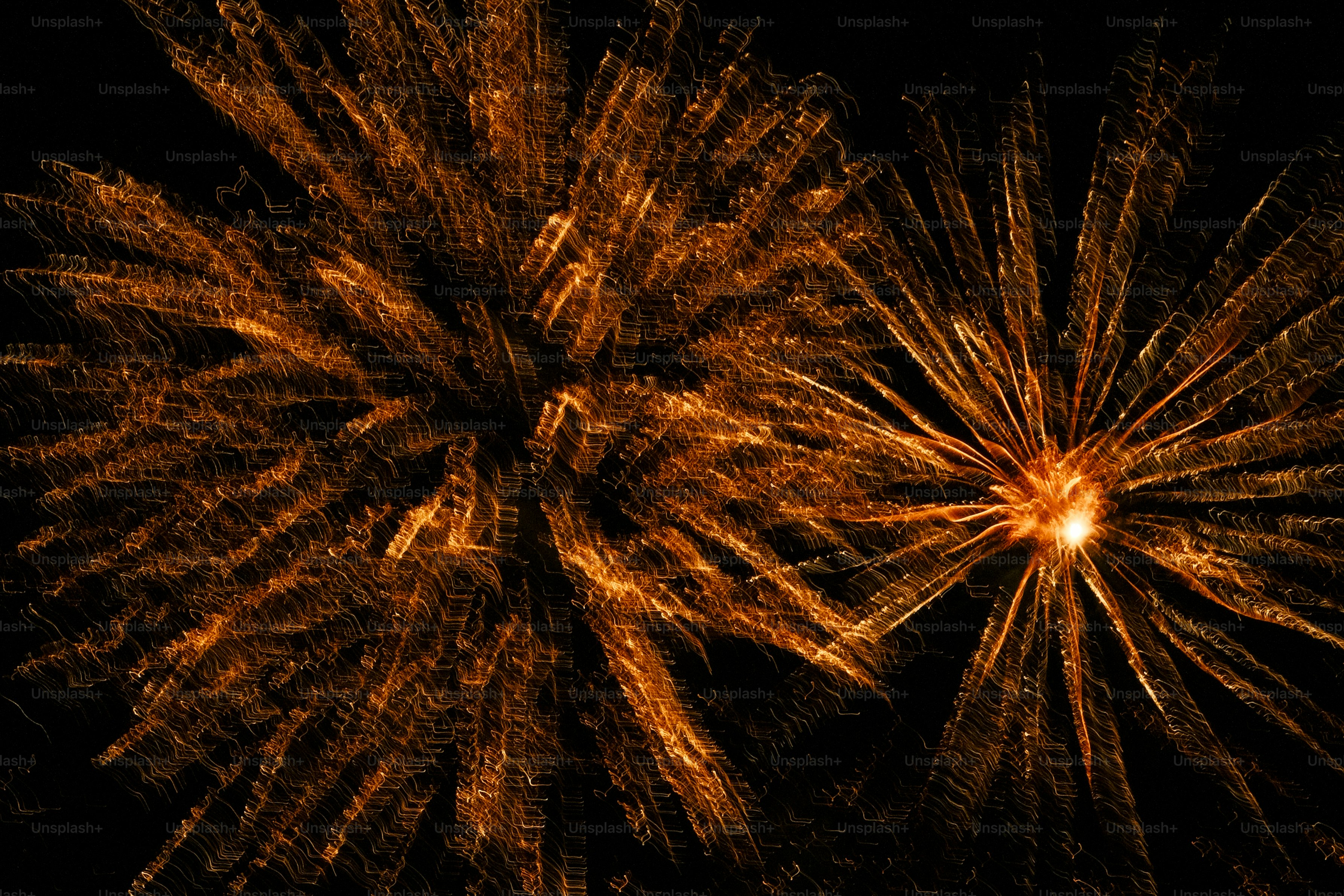 A firework is shown in the dark sky