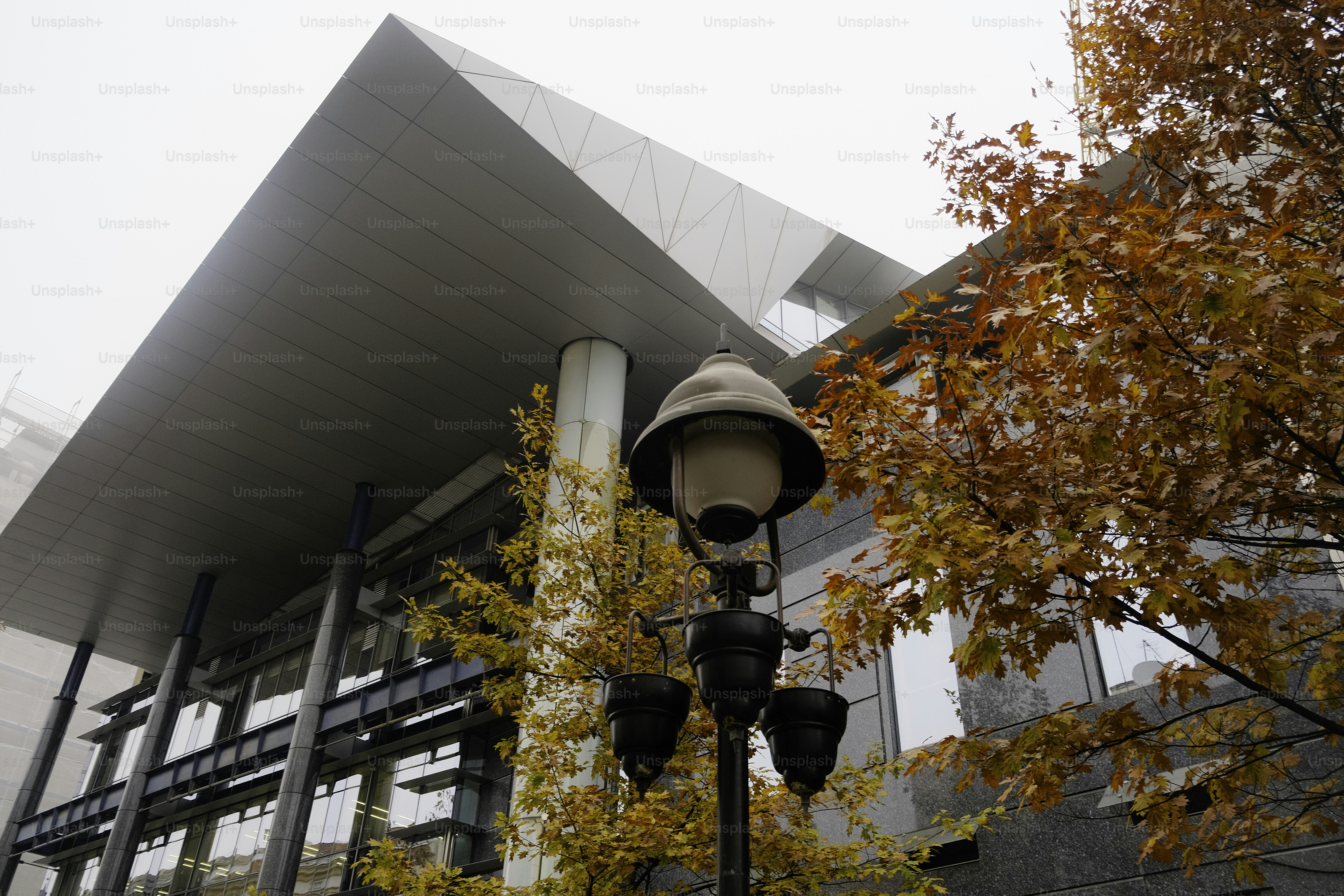 A lamp post in front of a large building