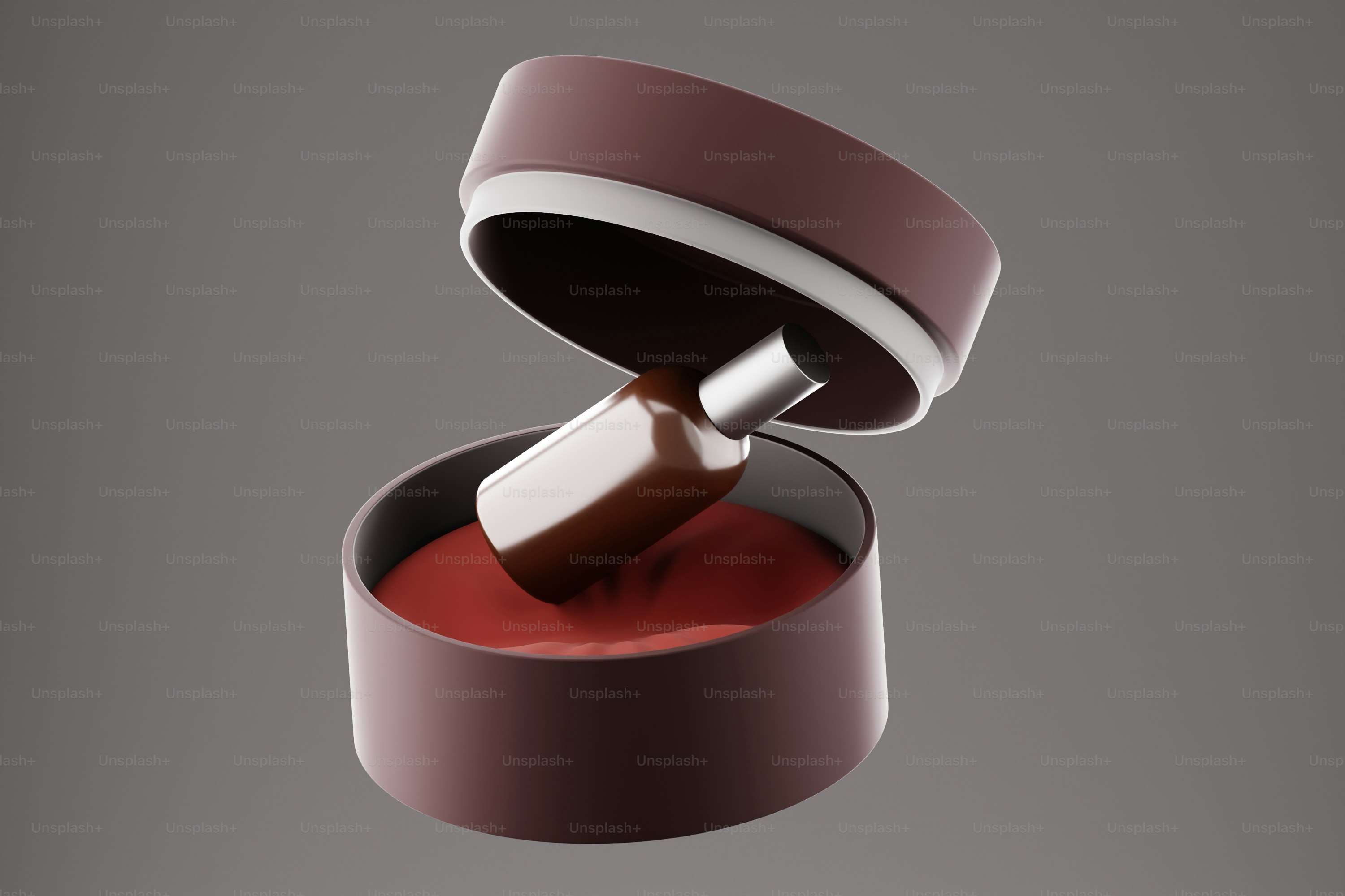 A red ring with a wooden handle on a gray background