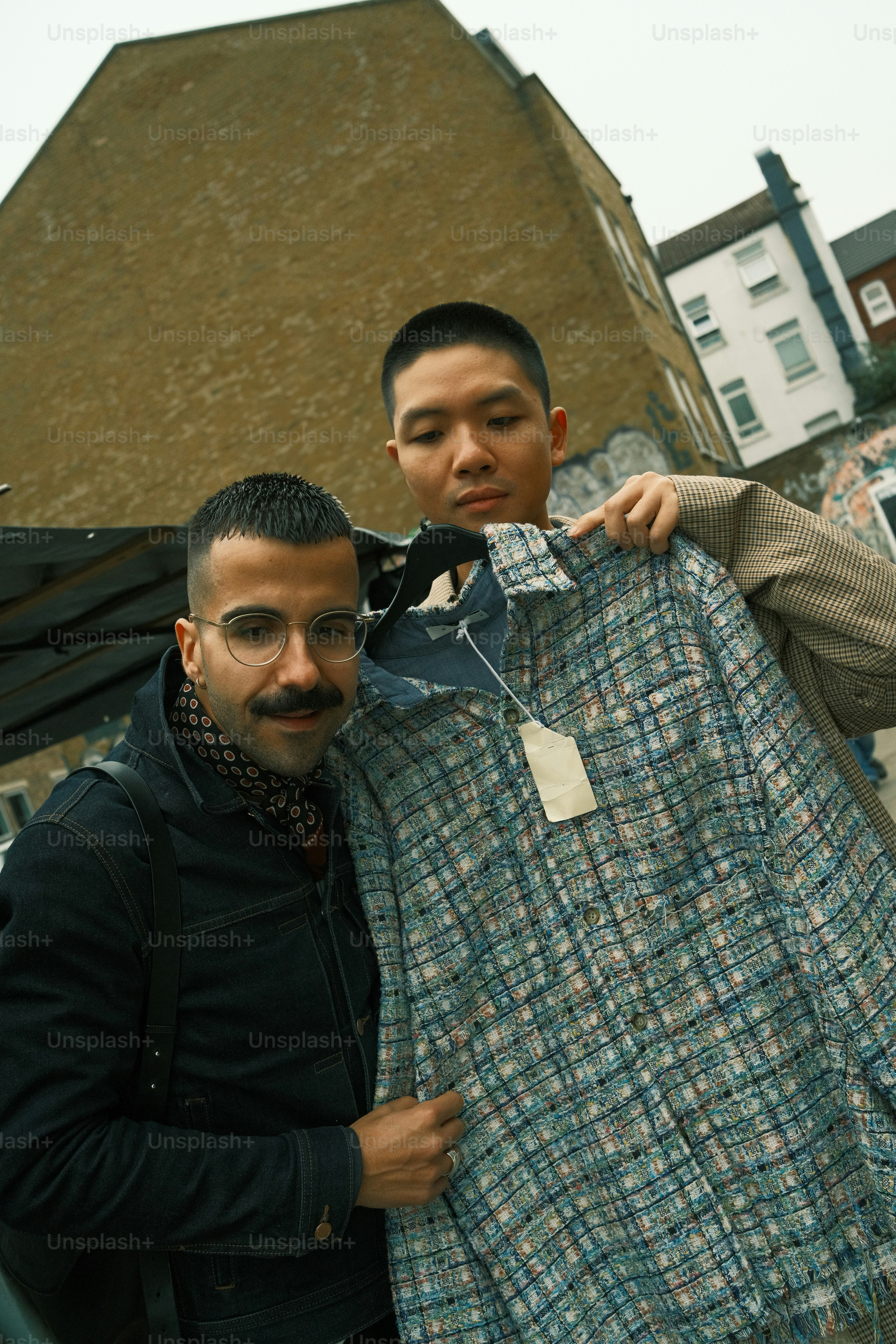 A couple of men standing next to each other