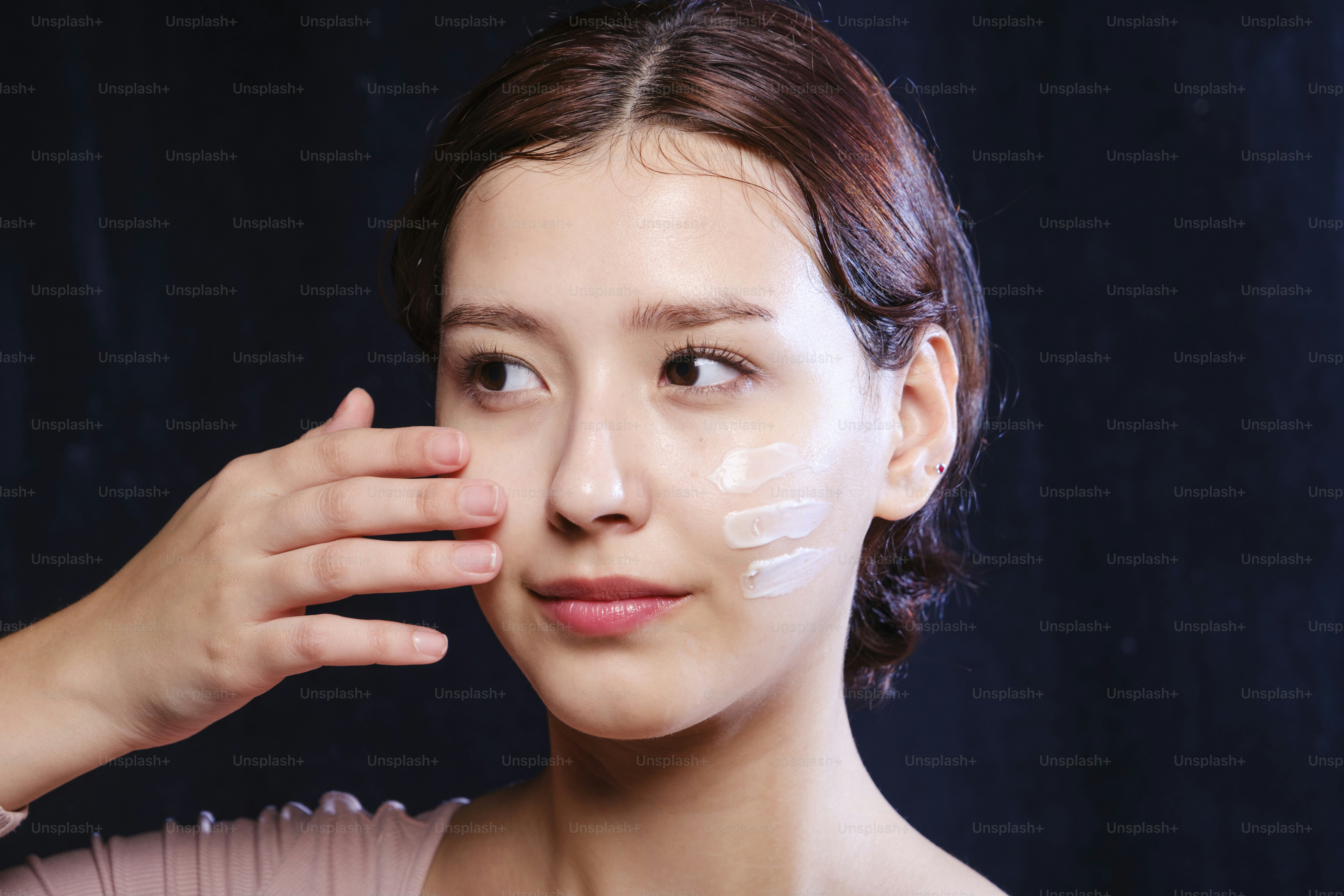 A woman with a white patch on her face