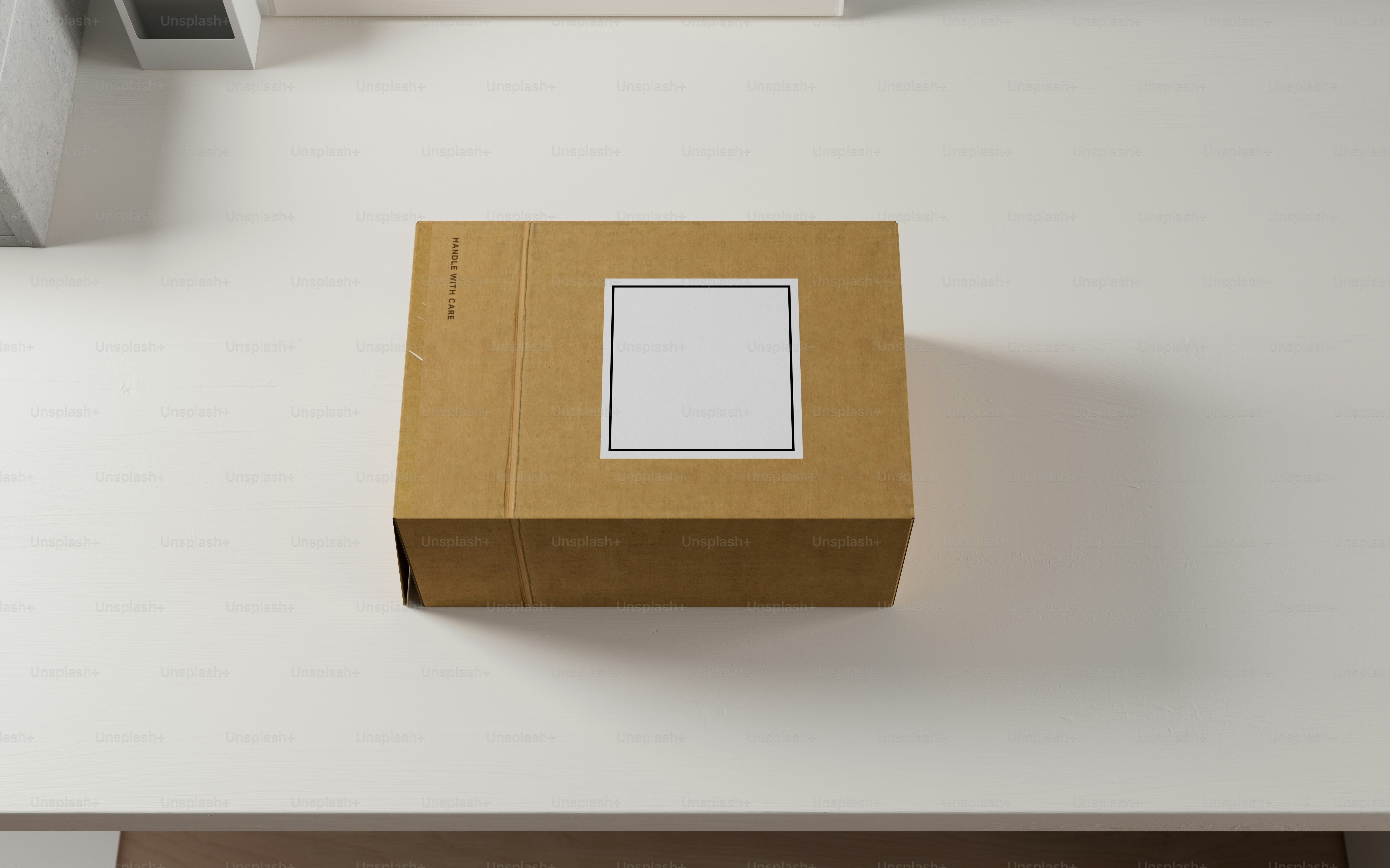 A brown box sitting on top of a white table