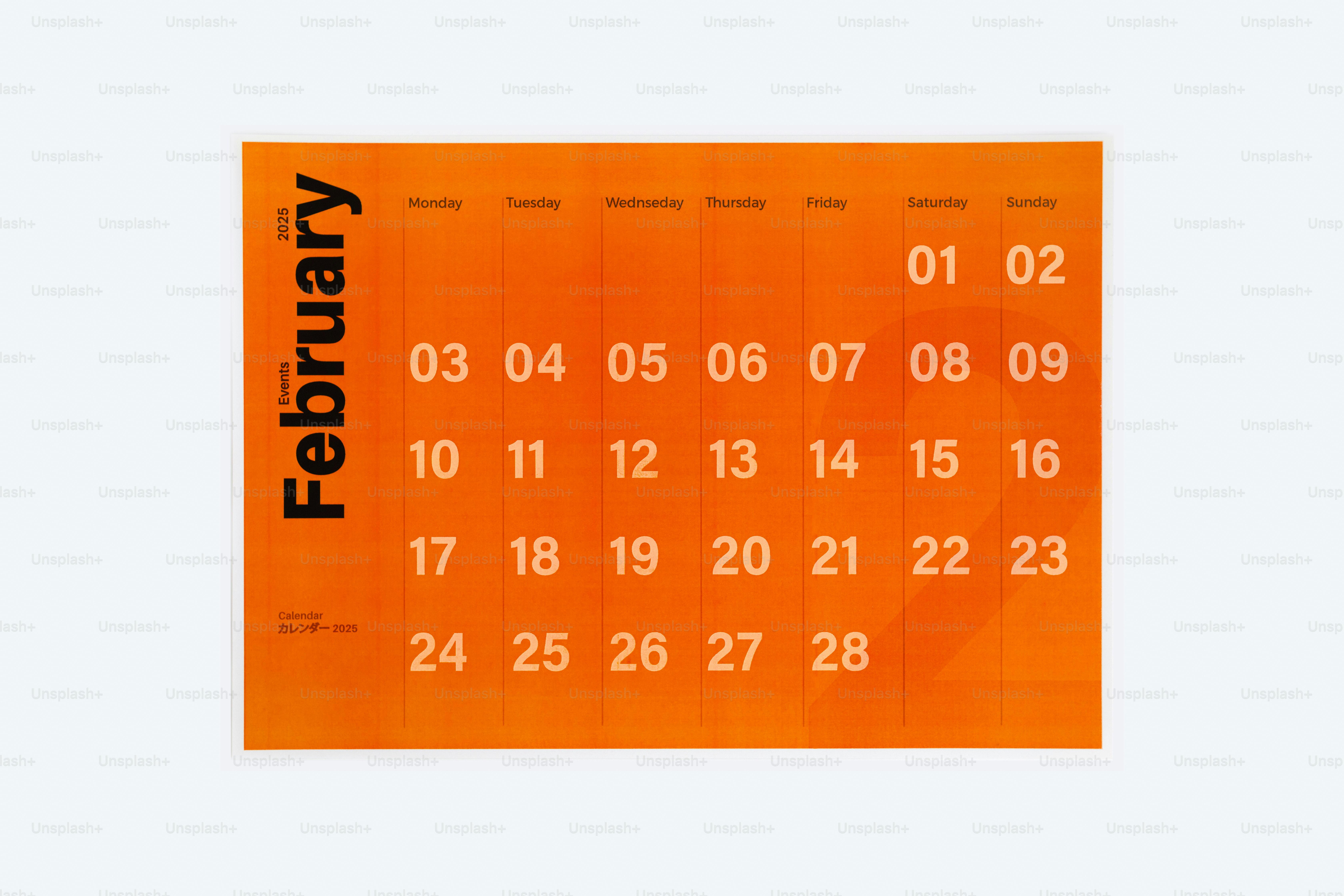 An orange calendar with a white background