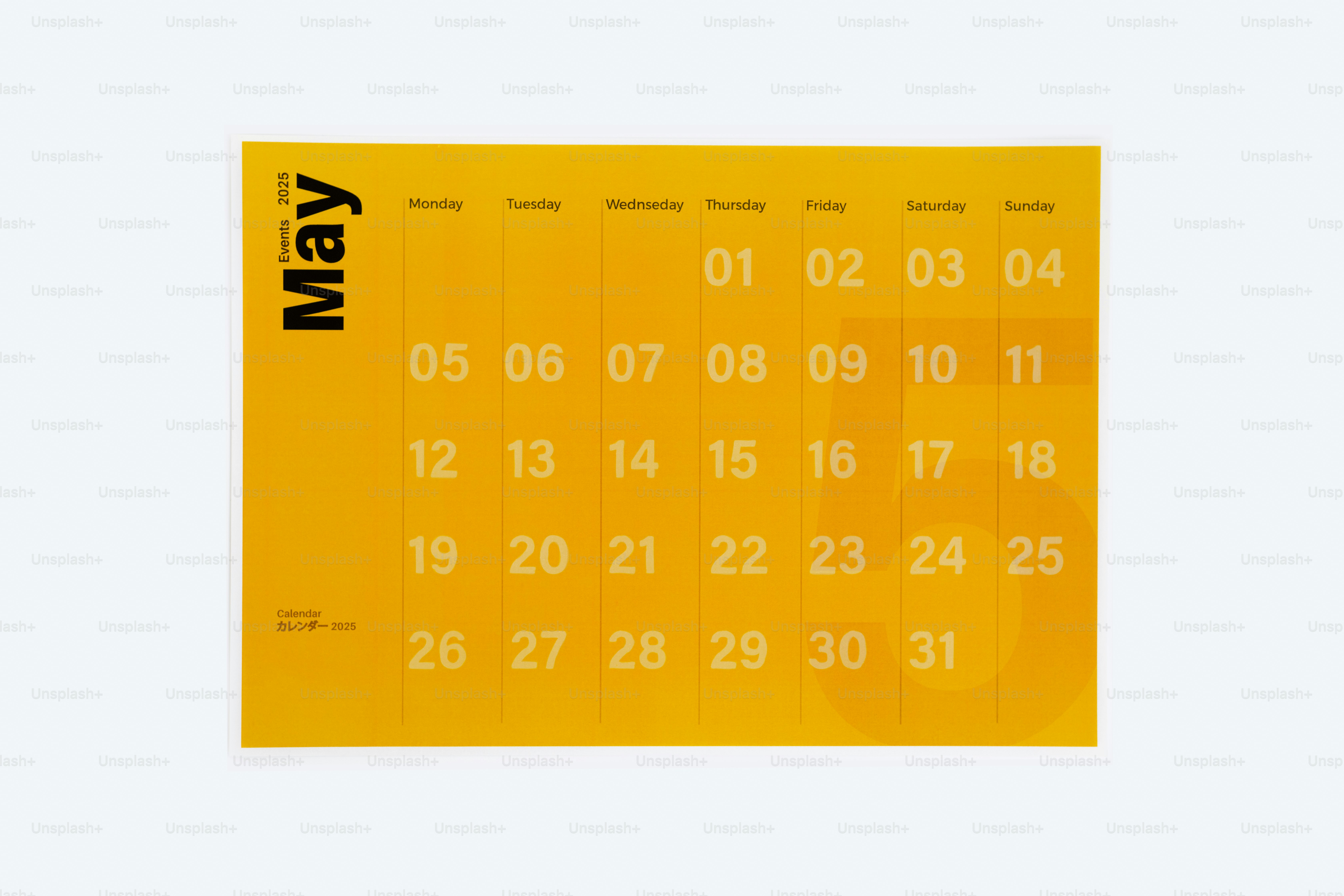 A yellow calendar with the word new on it
