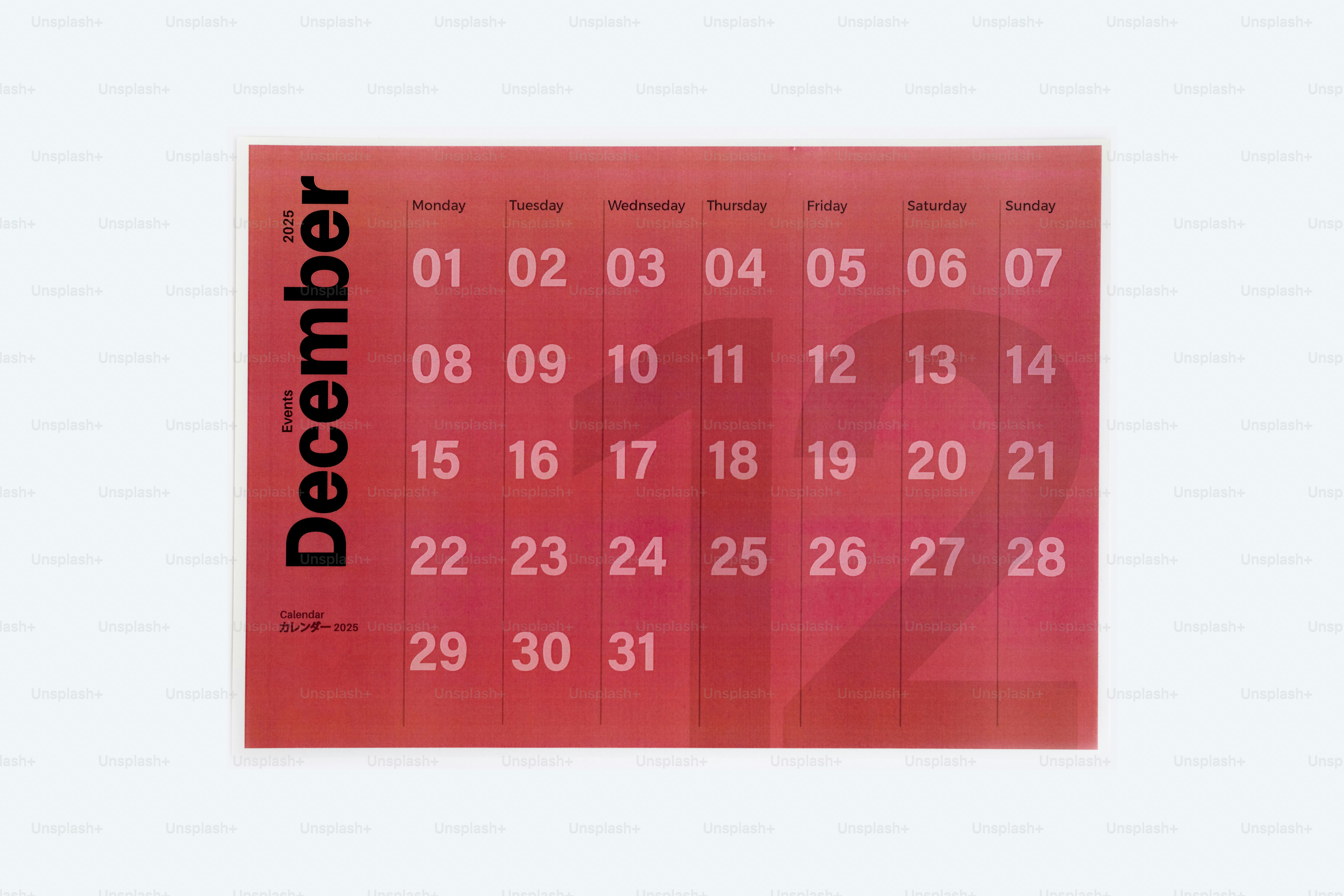 A red calendar with the date of december on it