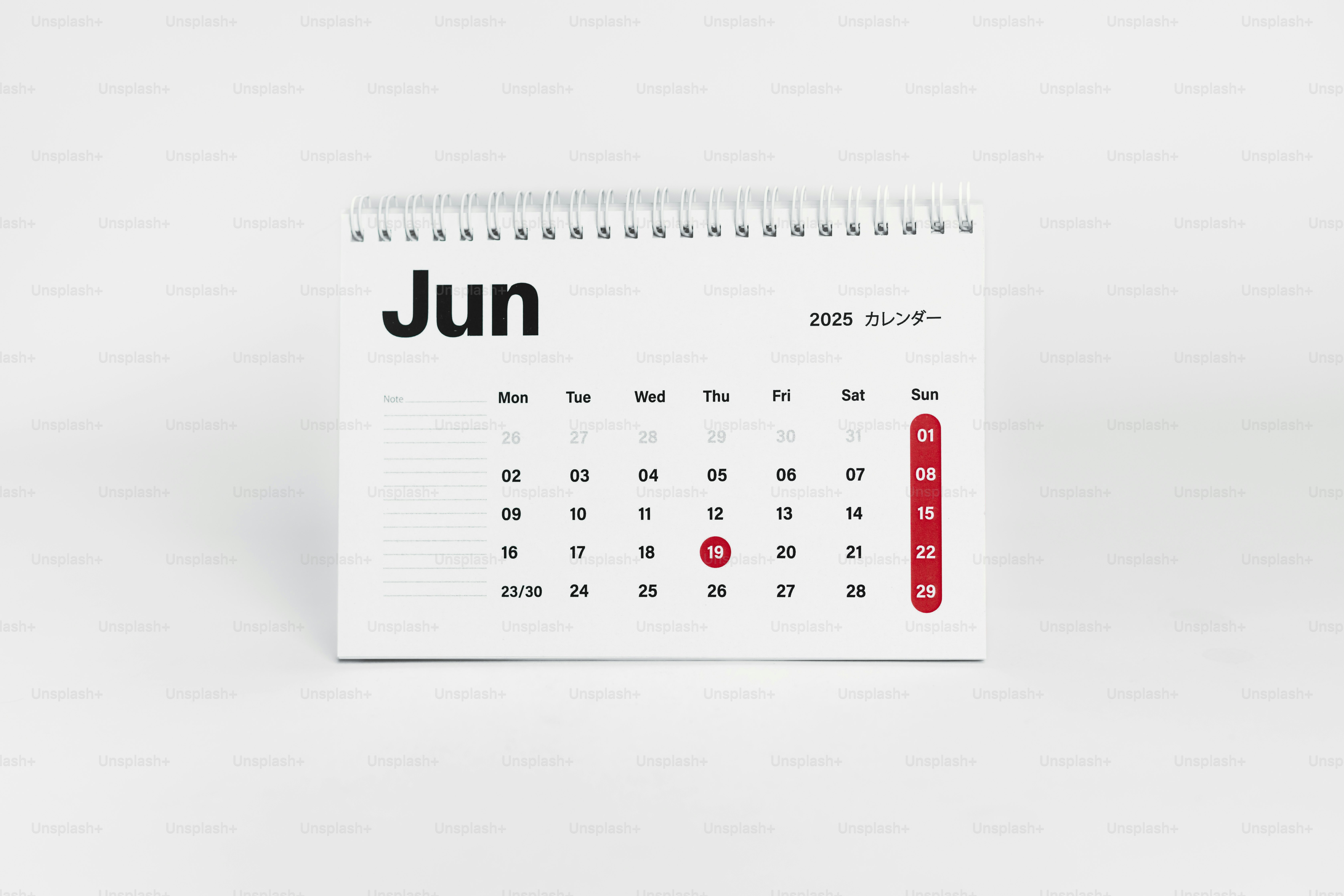 A white calendar with the word june on it