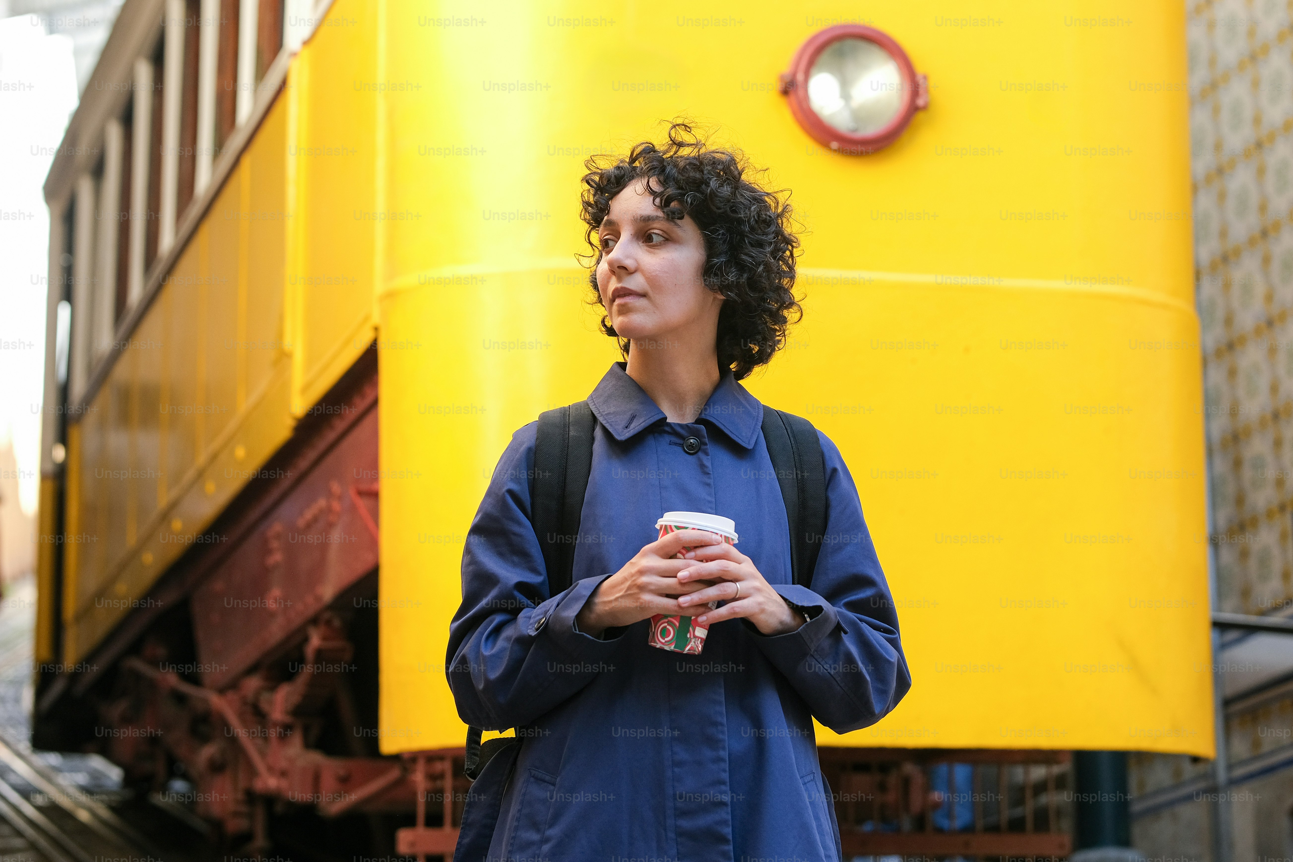 A man standing in front of a yellow box