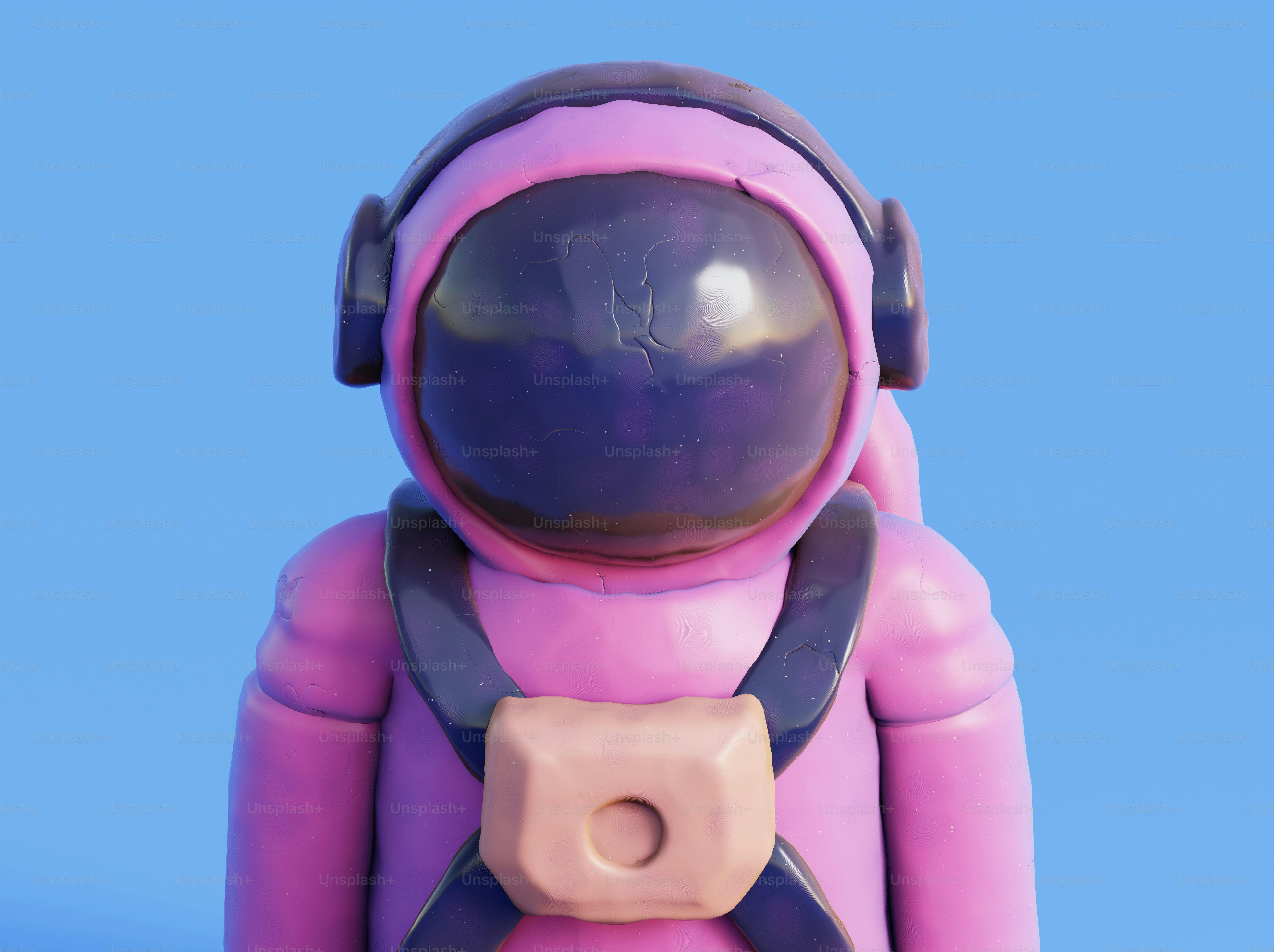 A pink and black toy with headphones on photo – Spaceman Image on Unsplash