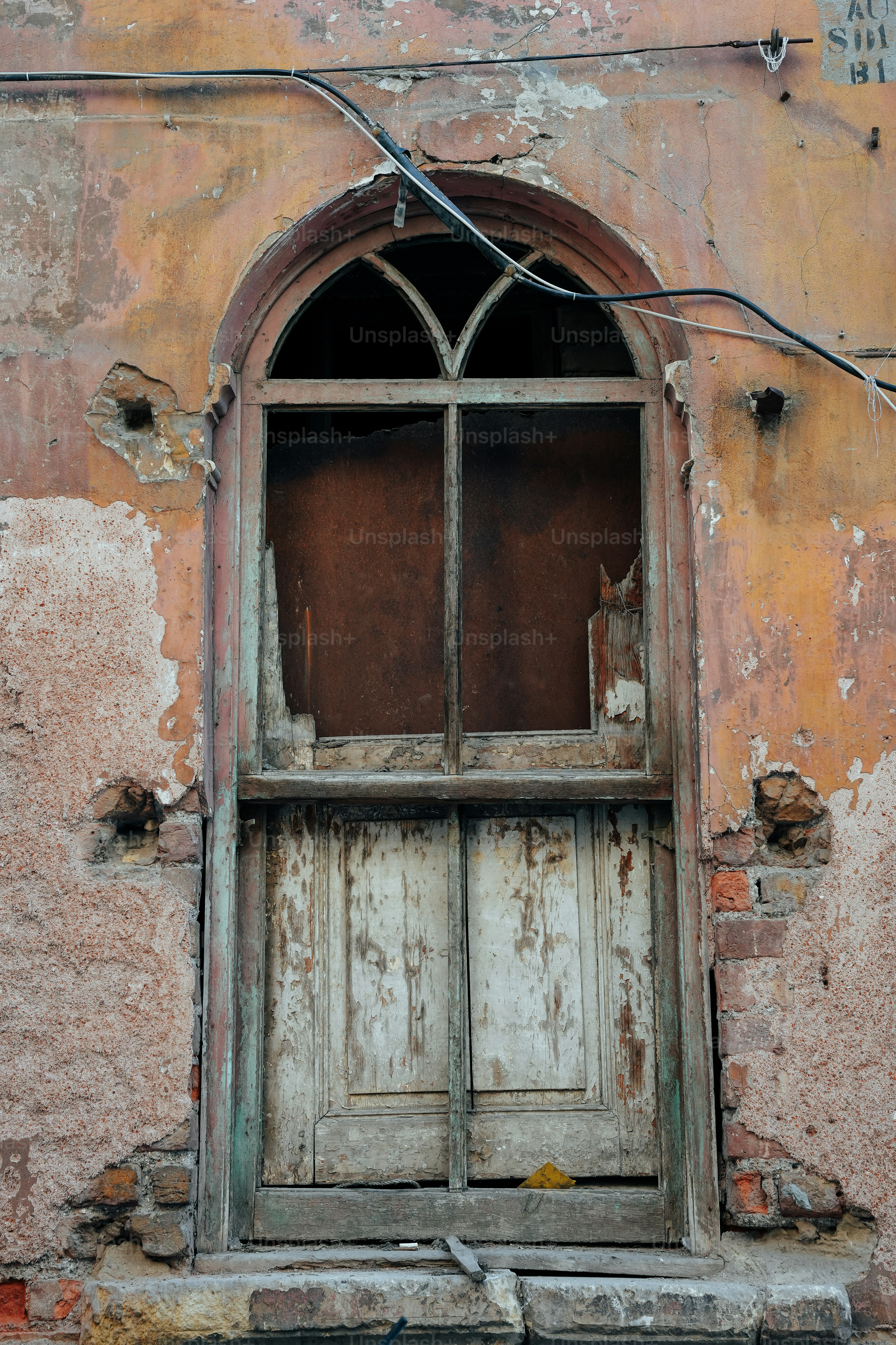An old building with a wooden door and window