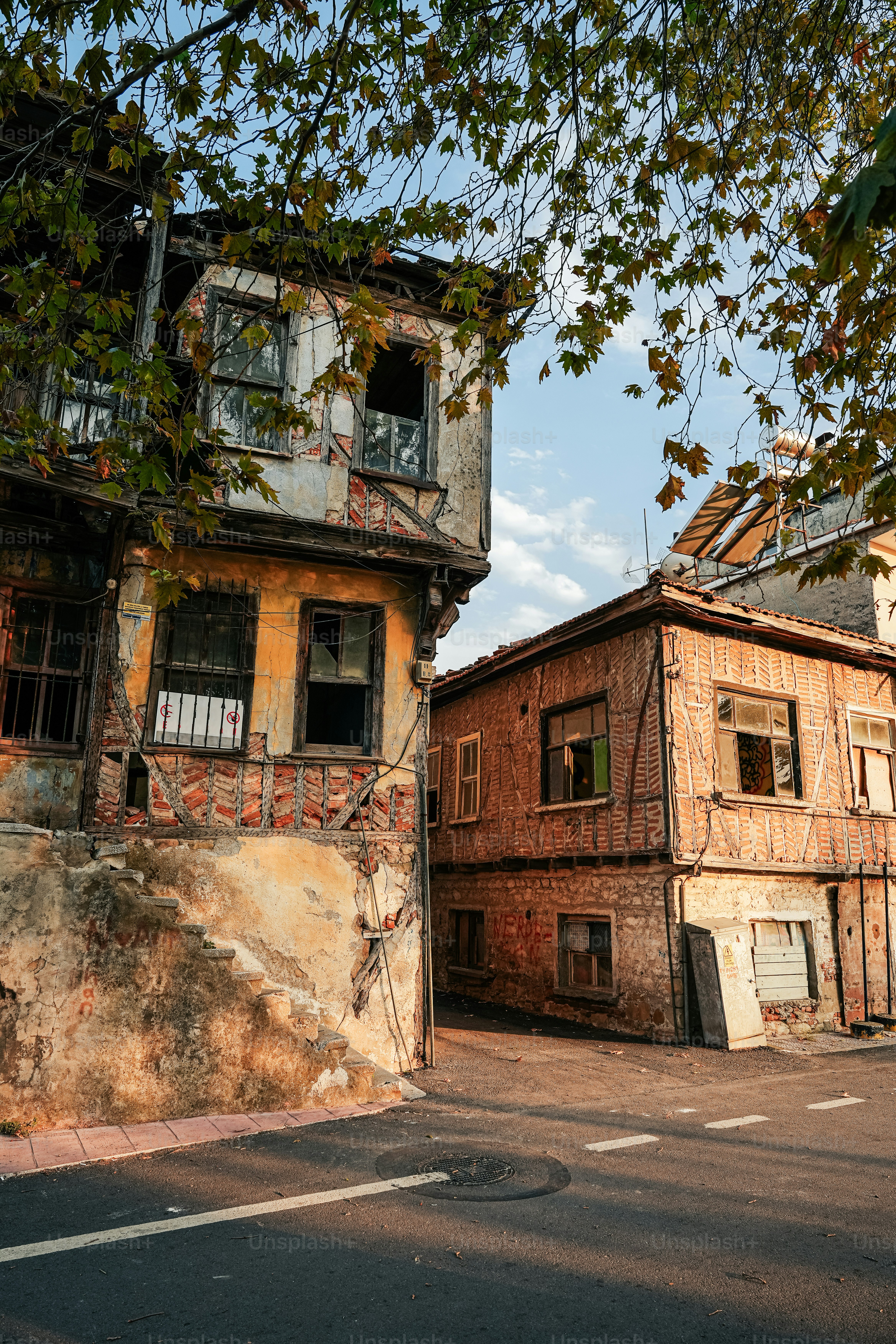 An old run down building on a street corner