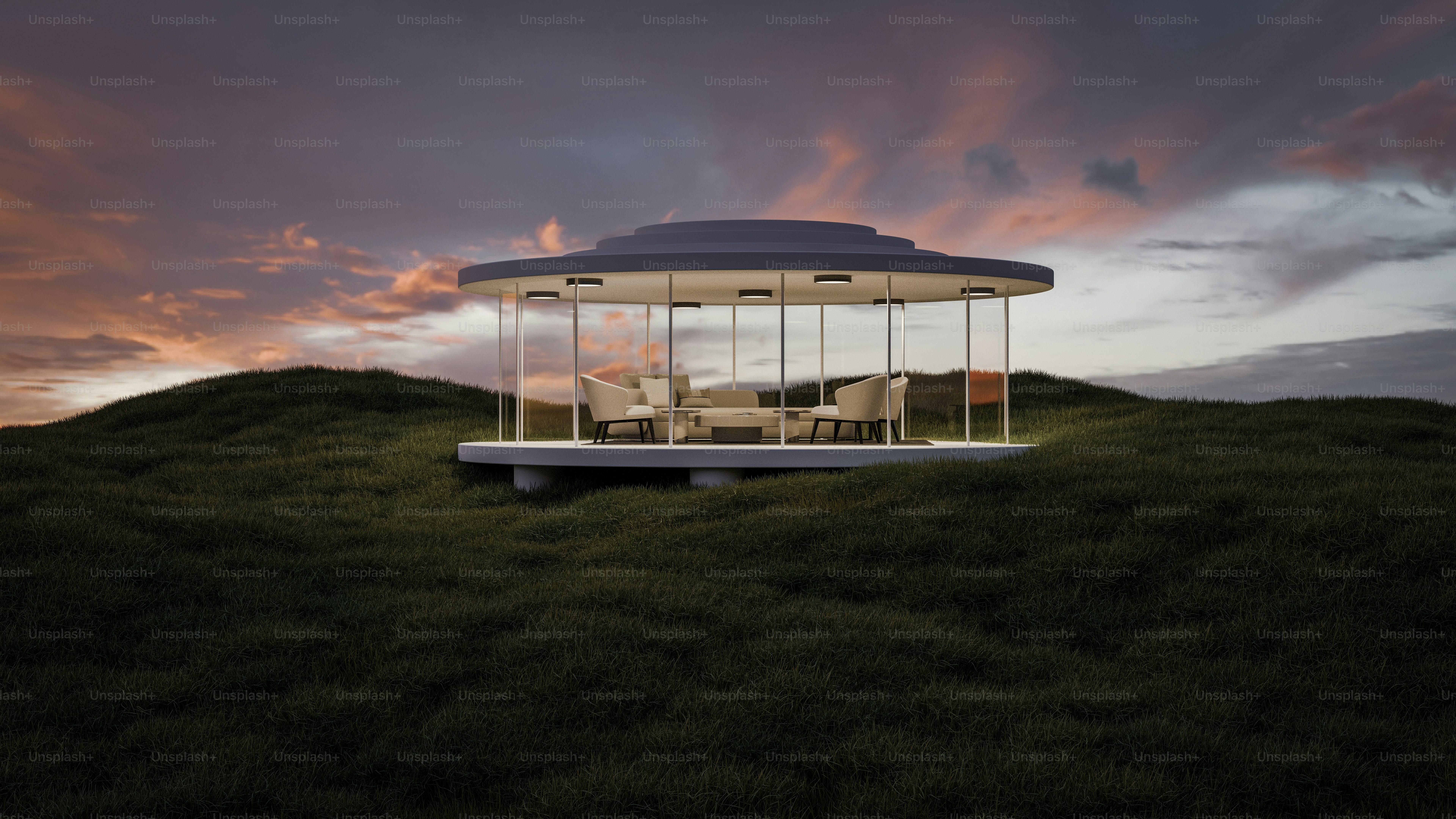 A round structure sitting on top of a lush green hillside photo ...