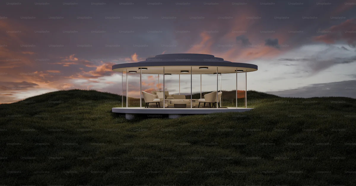 Round Top Structure A round structure sitting on top of a lush green hillside photo ...