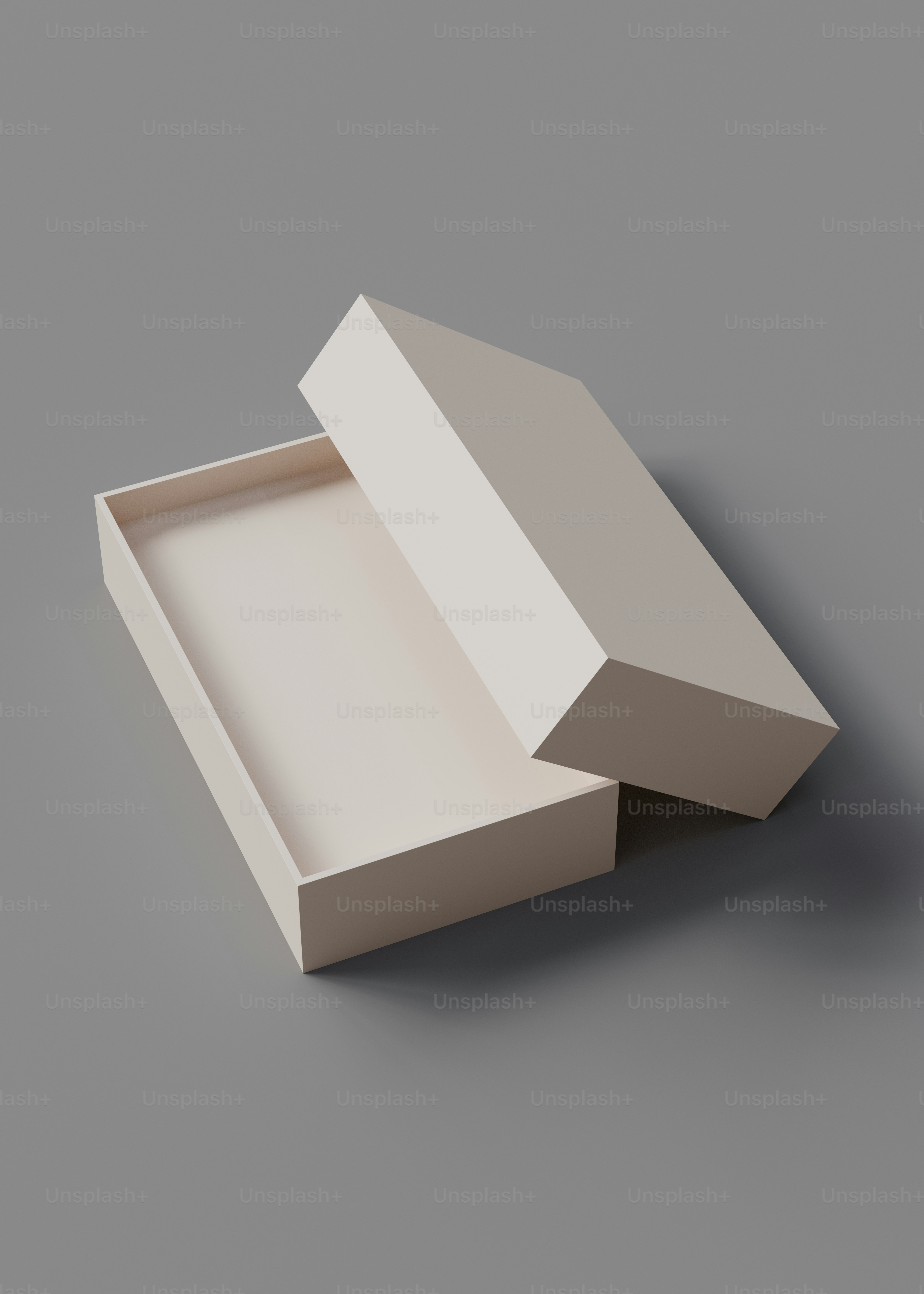 Una caja blanca que está abierta sobre una superficie gris
