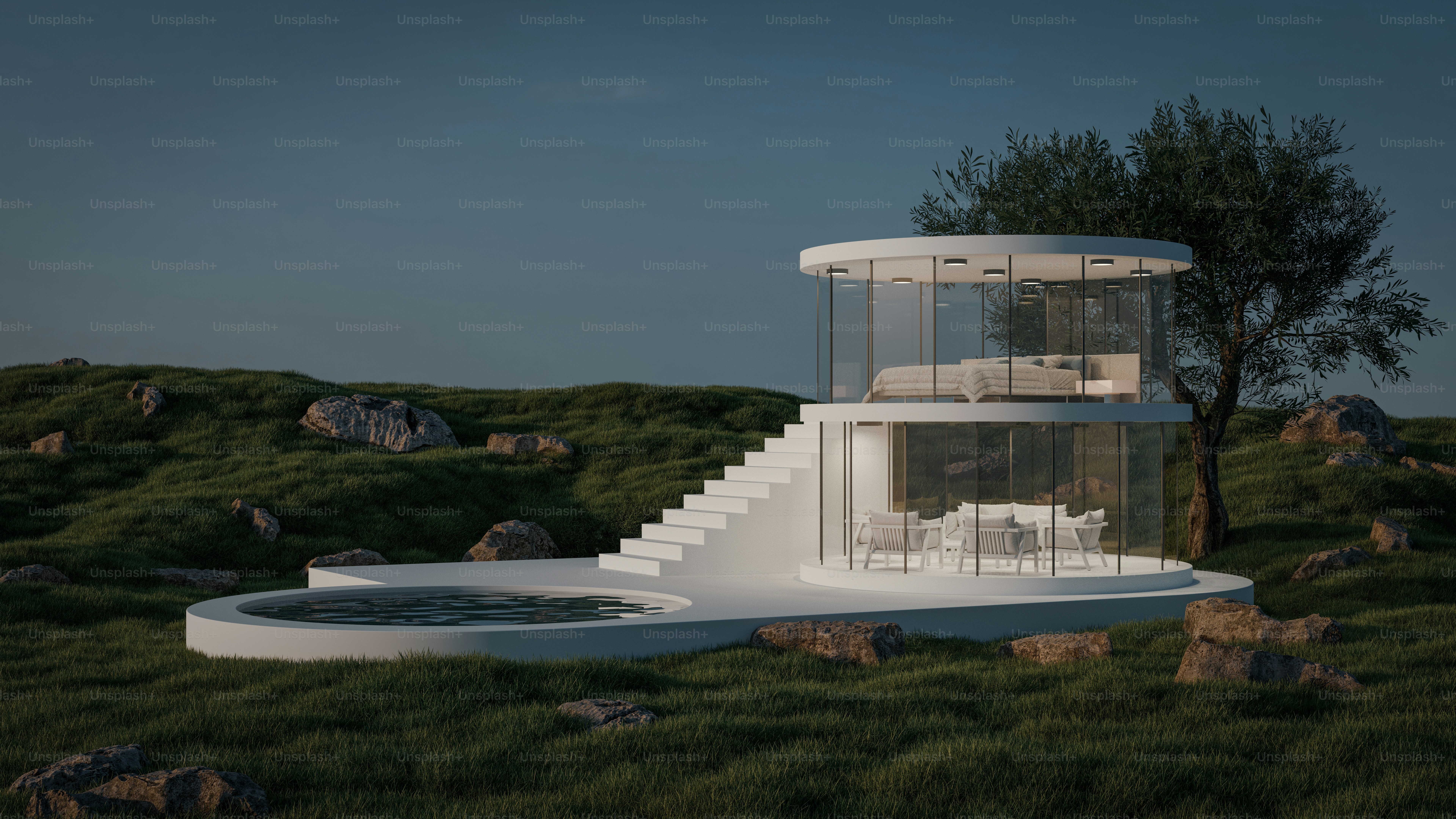 Una casa blanca en una colina con un árbol al fondo