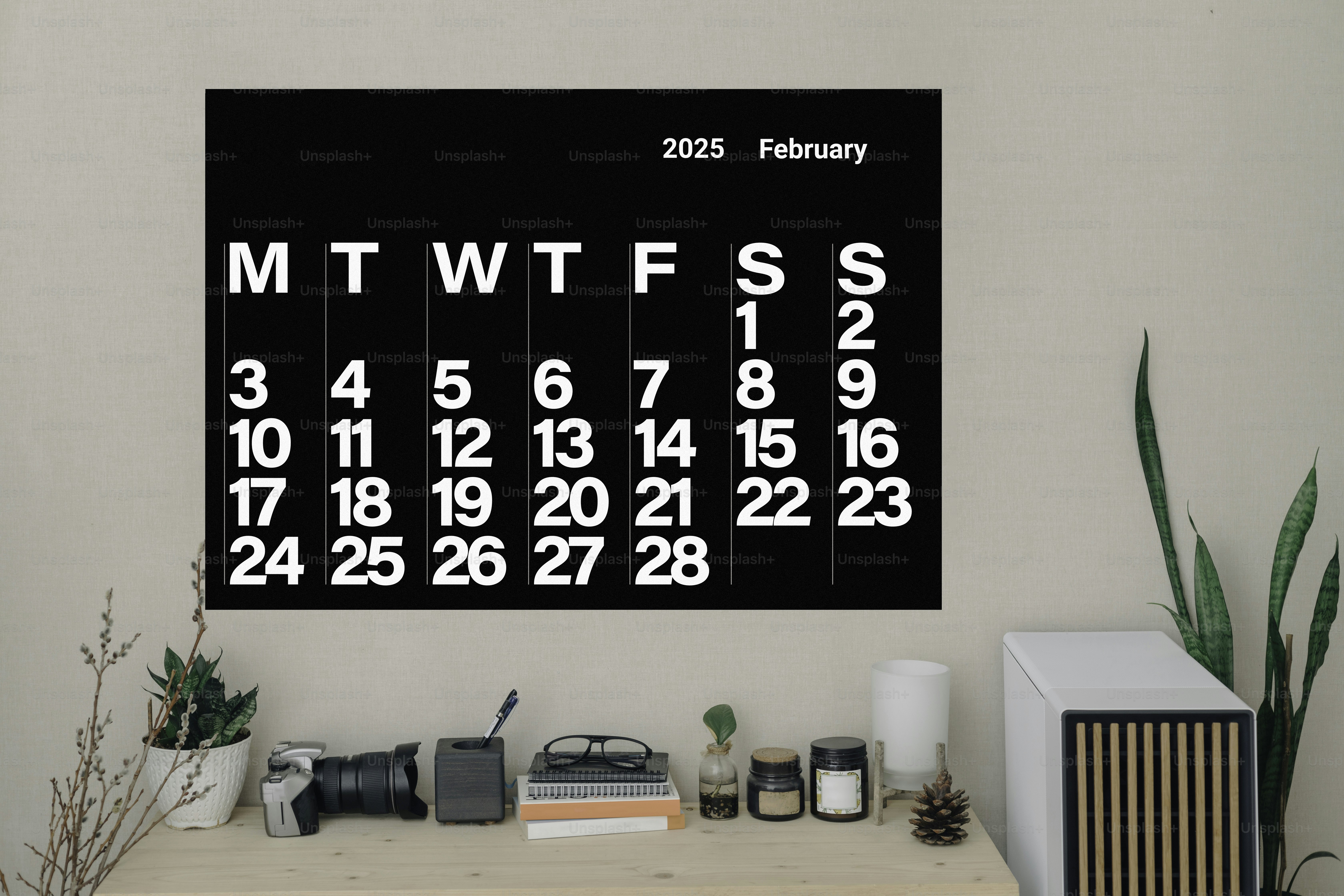 A black and white calendar hanging on a wall