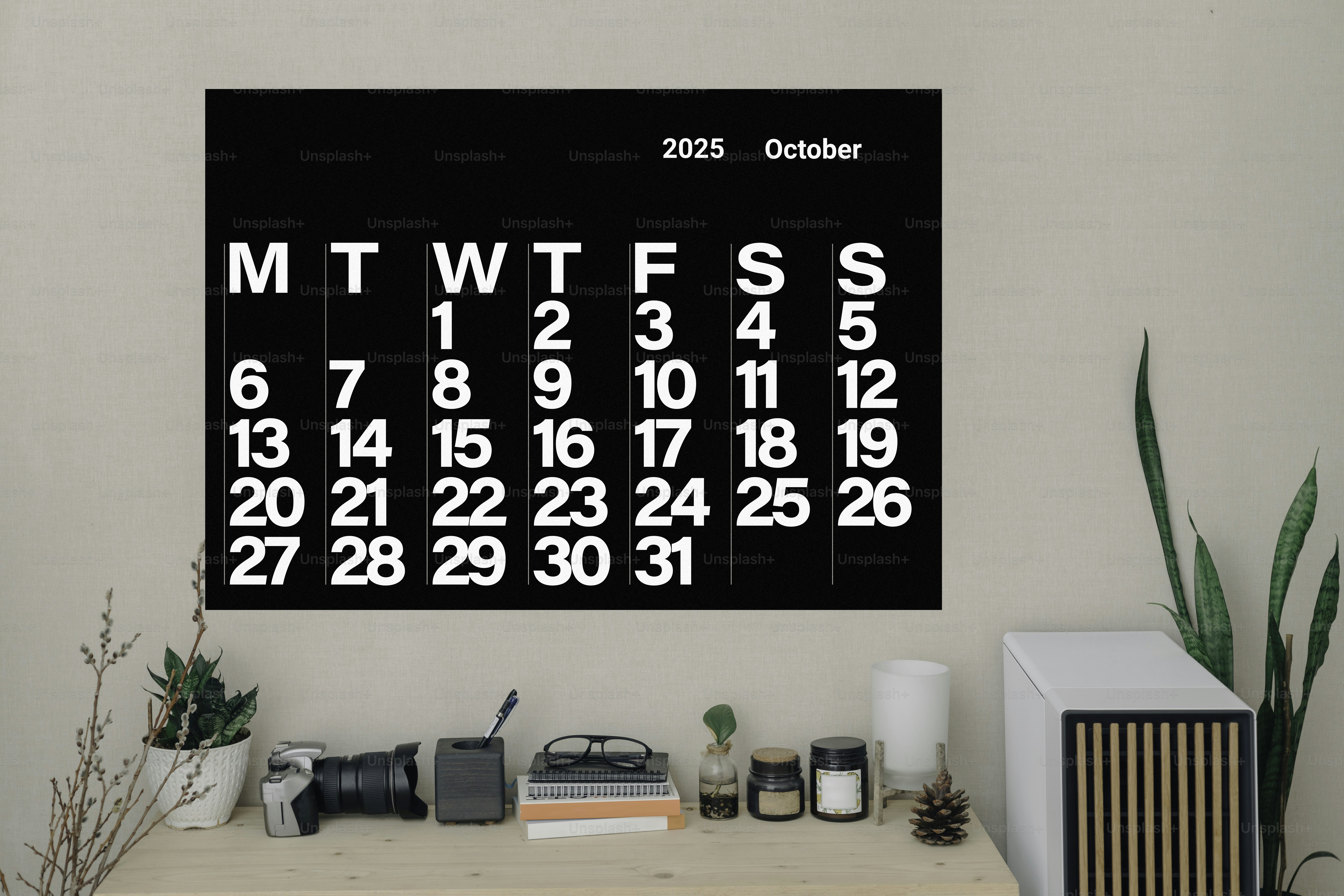 A black and white calendar hanging on a wall
