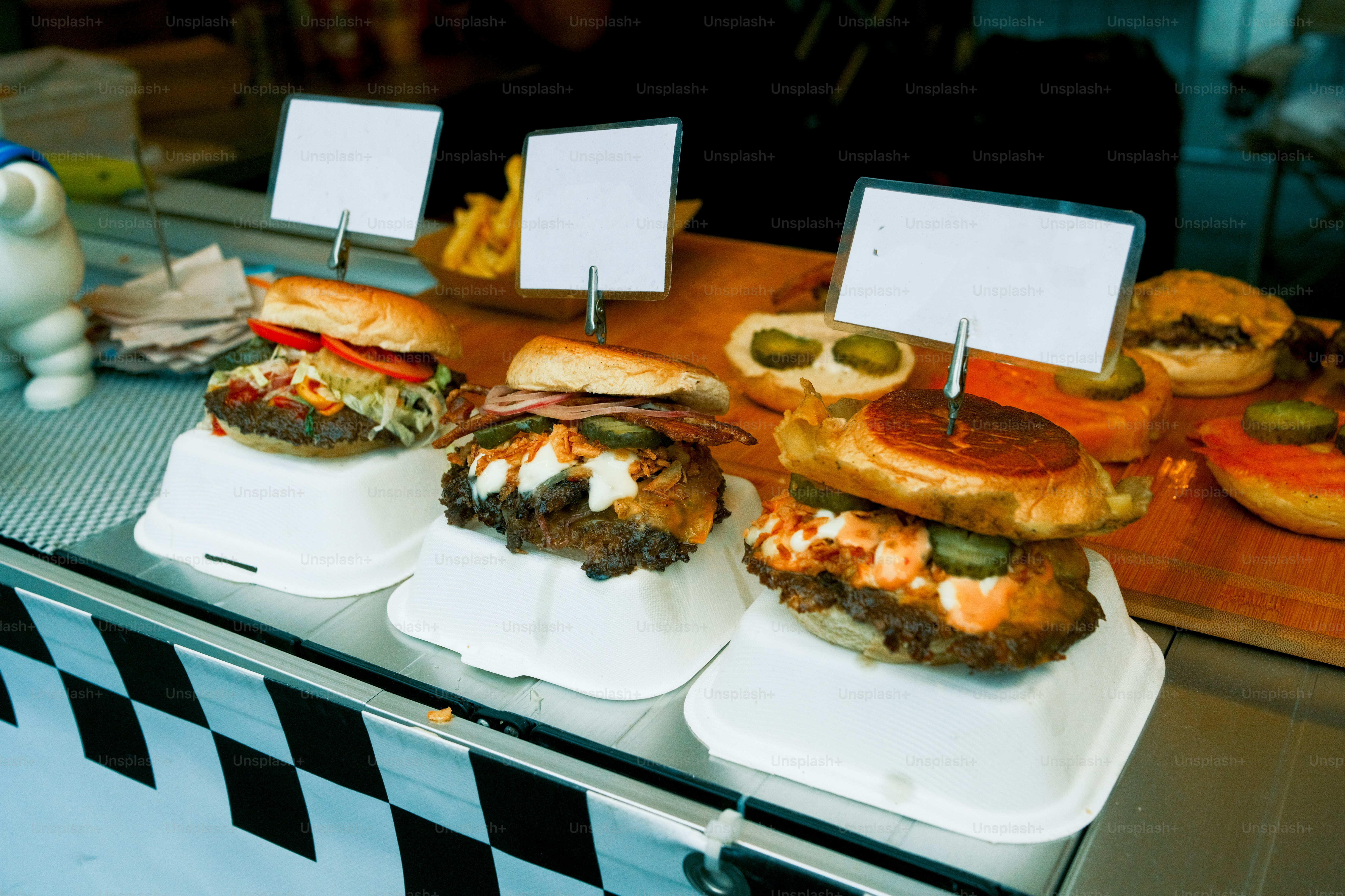 A display case filled with lots of hamburgers